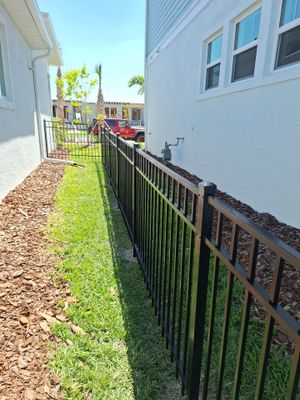 Aluminum Fence Installation using Black 3 Rail Aluminum Fence