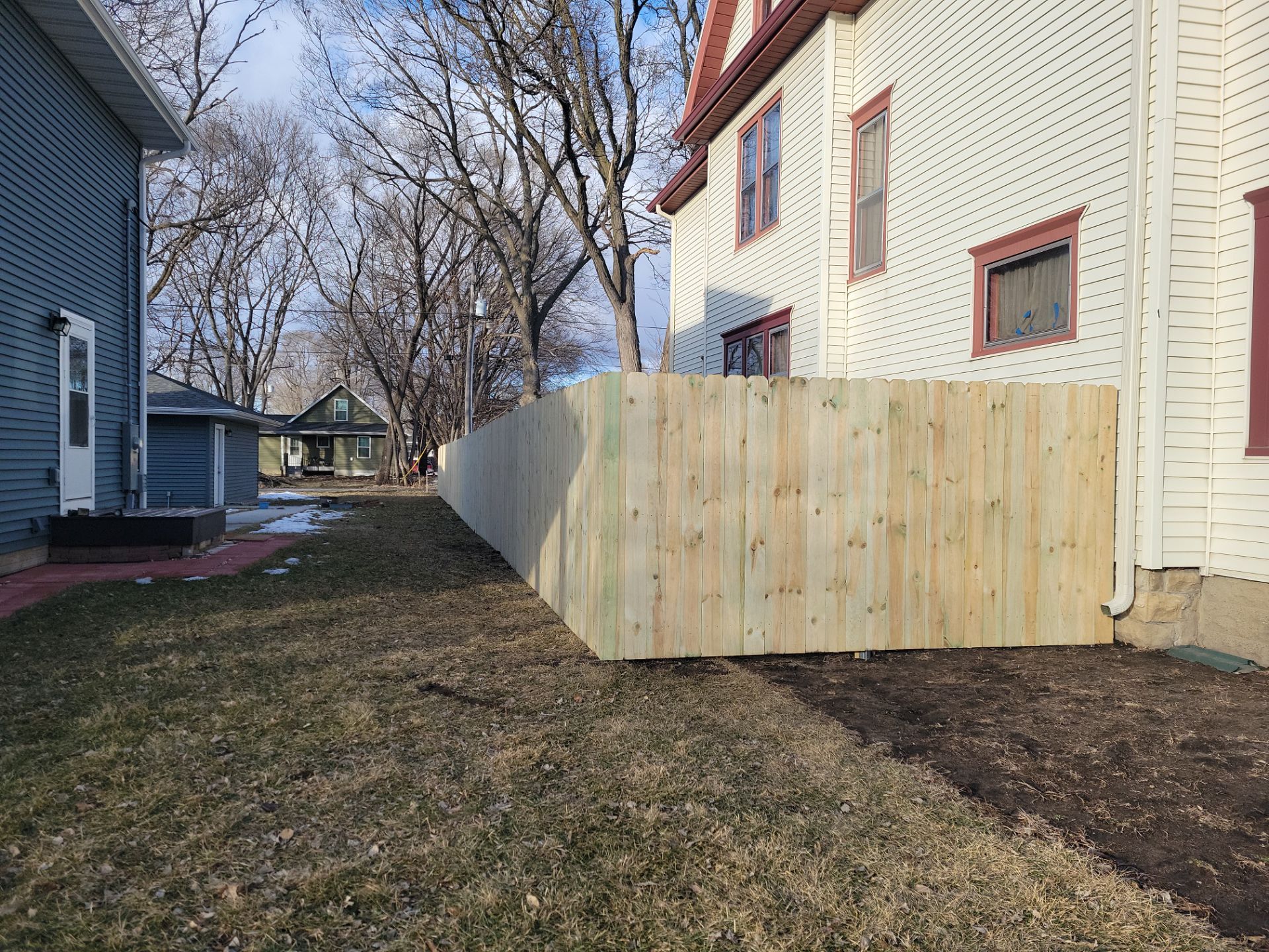 Pressure-Treated Wood Privacy Fence and Double Gate Installation in Waterloo by Perfect Picket Fence and Stain