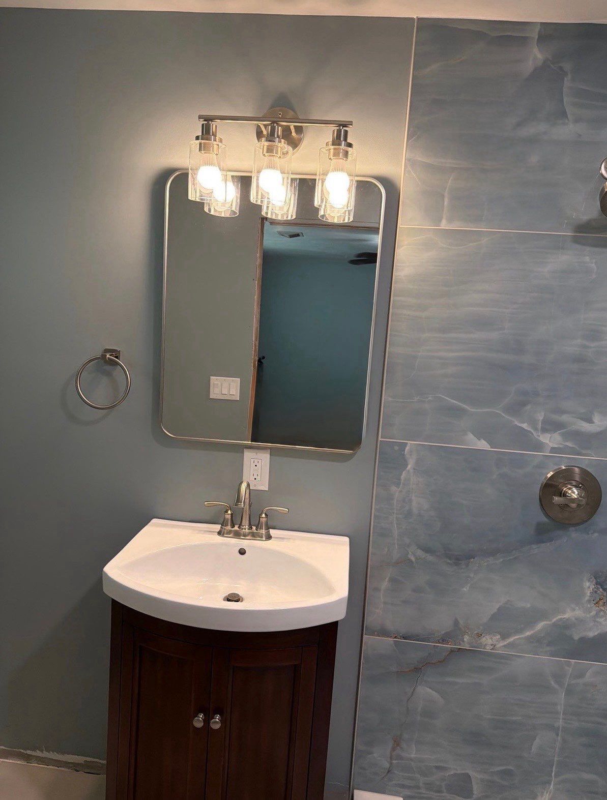 Elevated Bathroom Renovation featuring Oceanic Tile in Ormond Beach by Acies Renovations