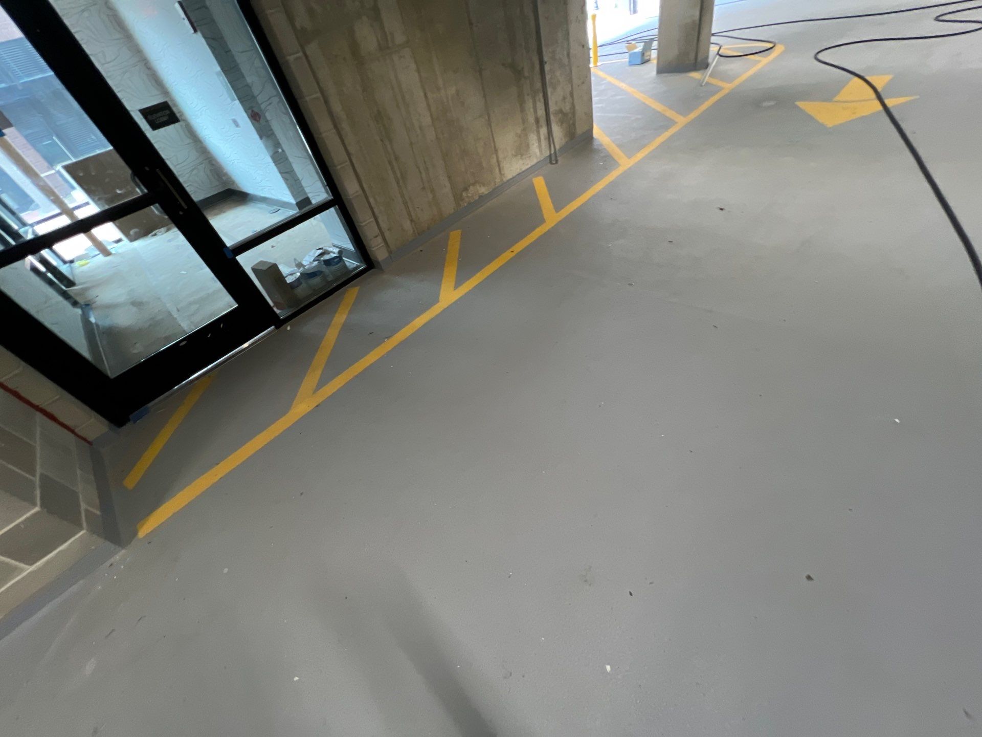 Parking garage using Hot water by Northern Power Washing LLC.