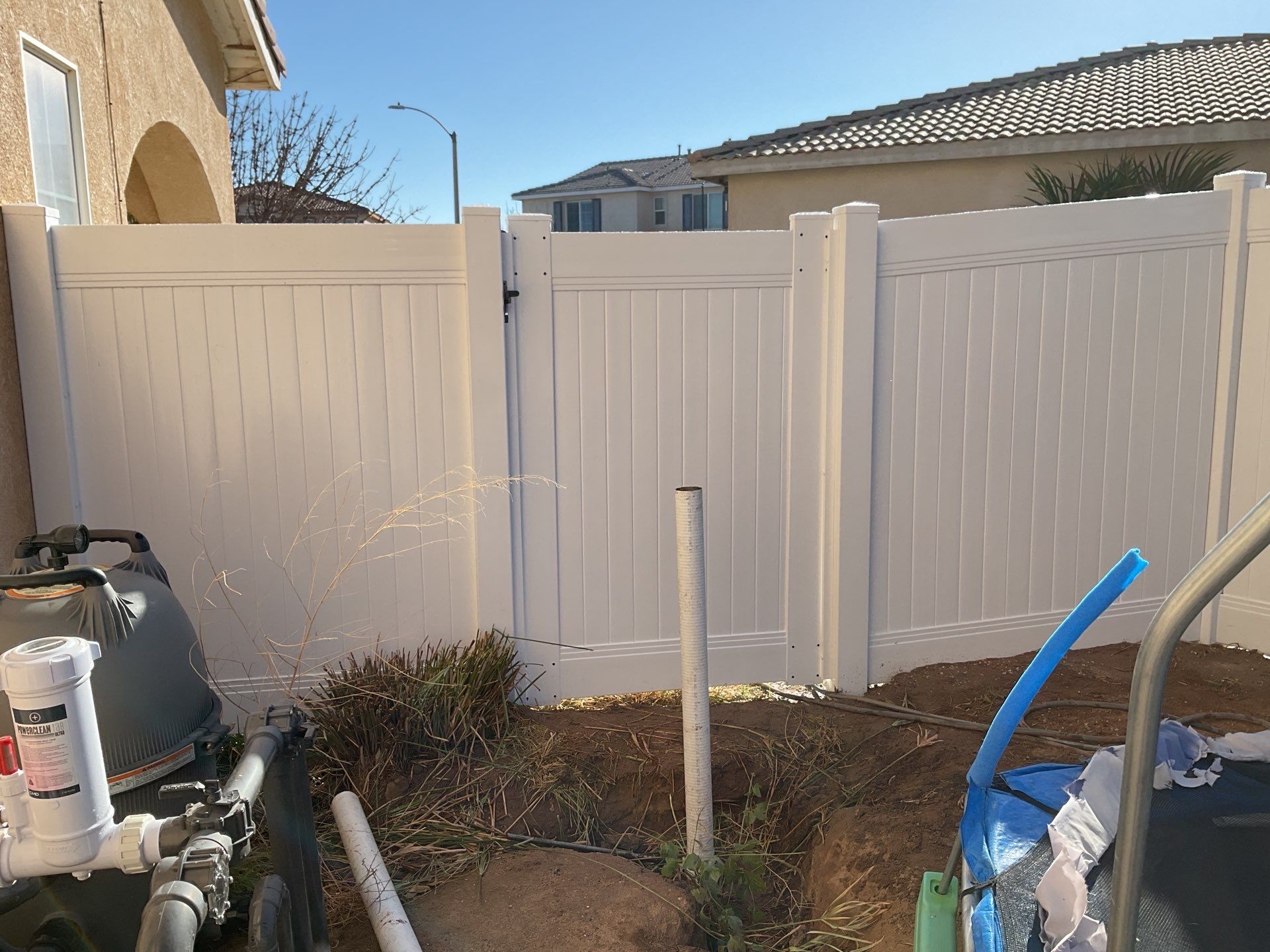 Fence installation using vinyl by Fence Guys Inc. 