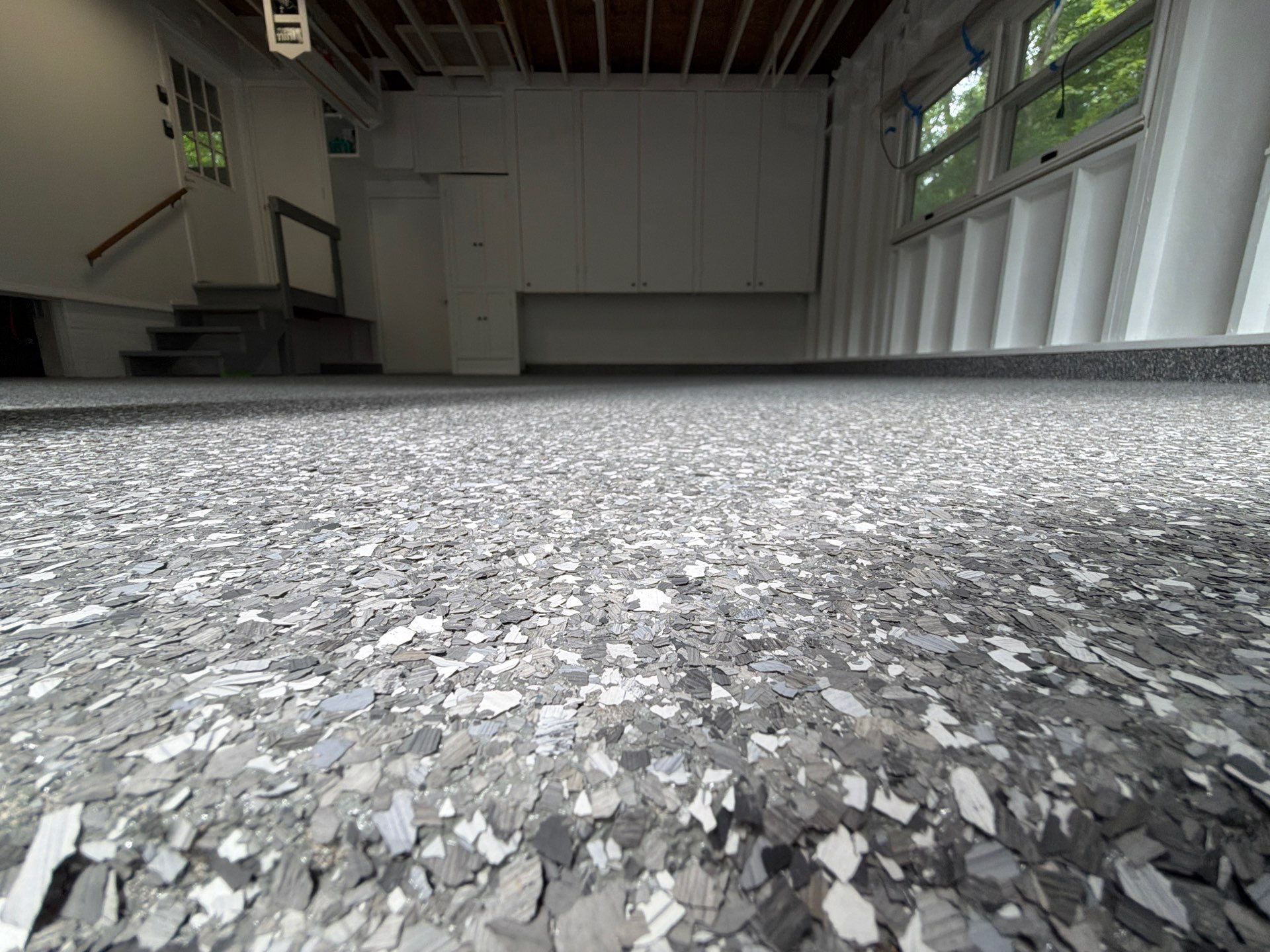 Pentwater Garage Epoxy Flake Floor Installation and Exterior Refinement by Gordon Painting