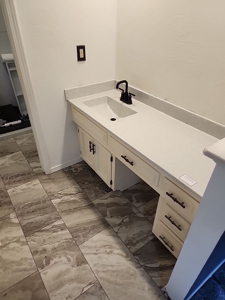 New shower, flooring, and countertop by The Shower Company