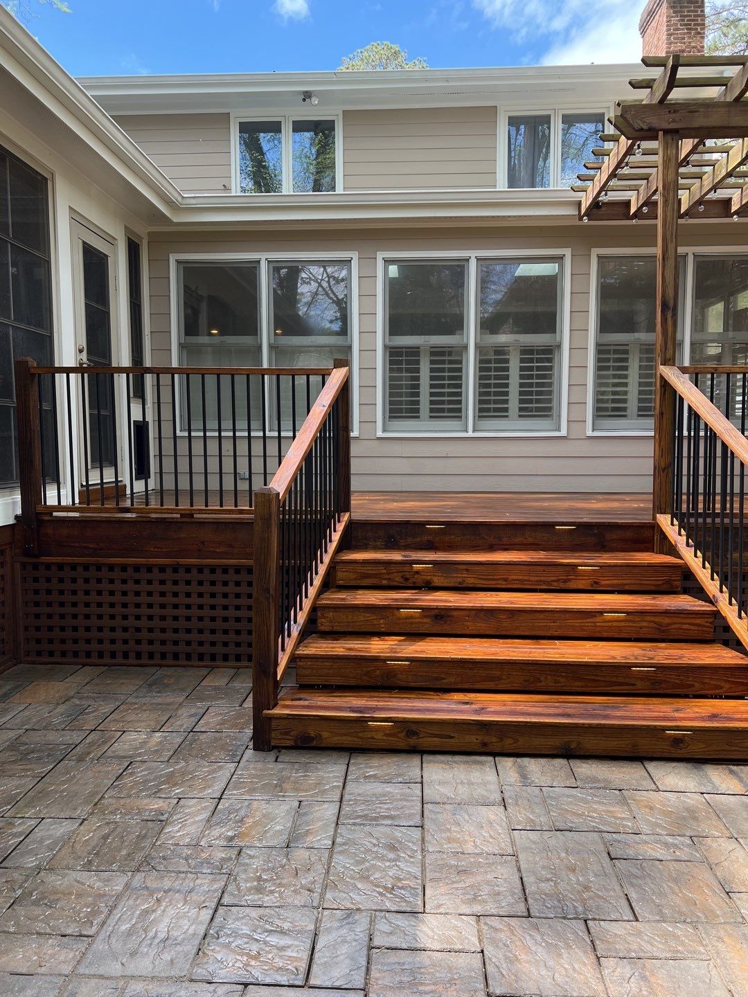 Deck and Stamped Concrete Patio by DuraSeal