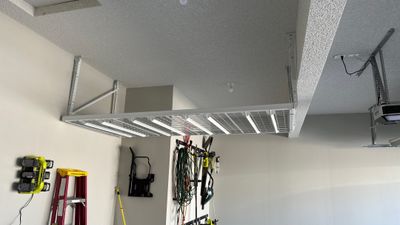 Brandon C. added these overhead racks to upgrade his storage