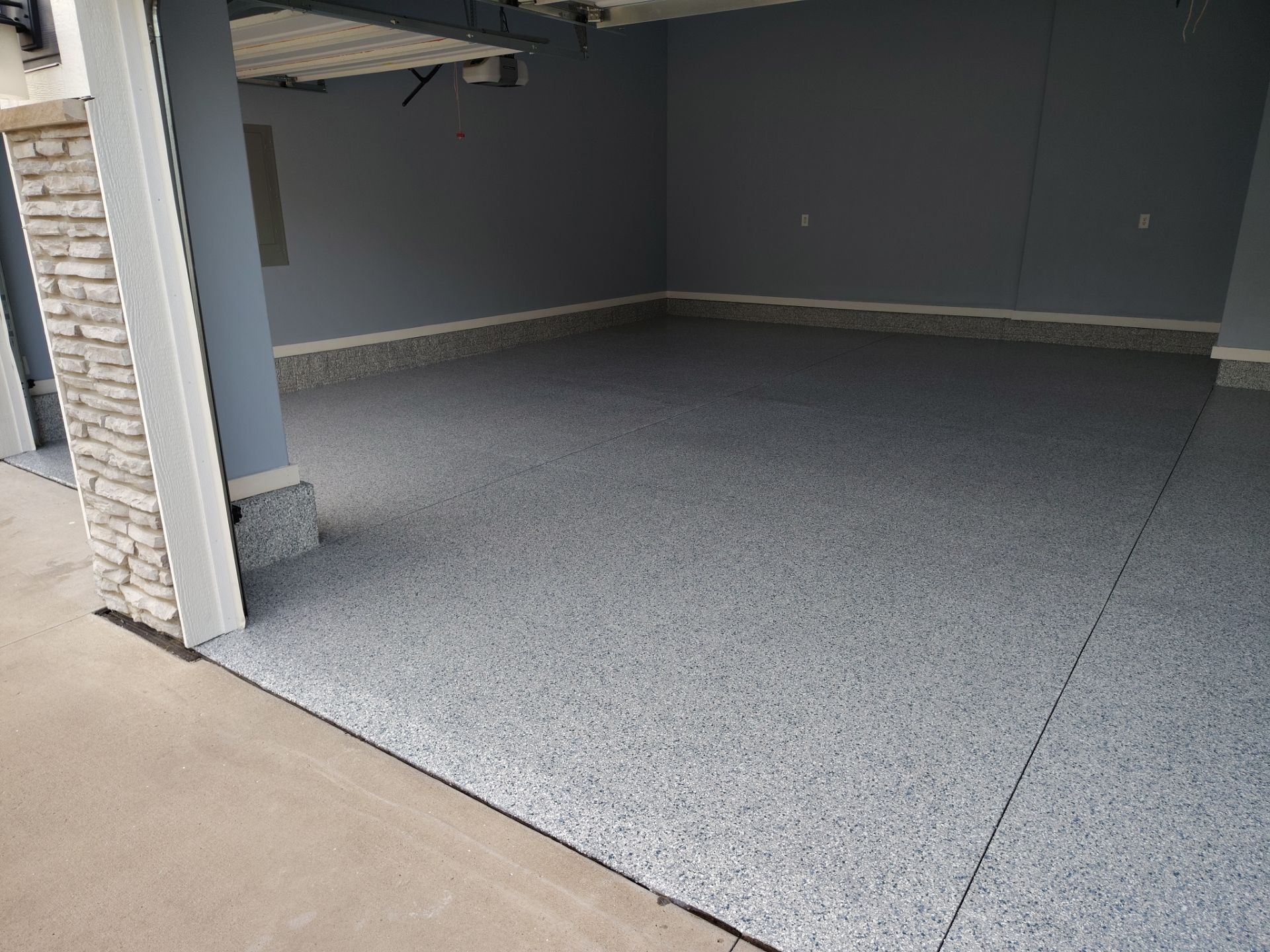 Tidal Wave Garage Transformation in Adel, Iowa by Revival Concrete Coatings