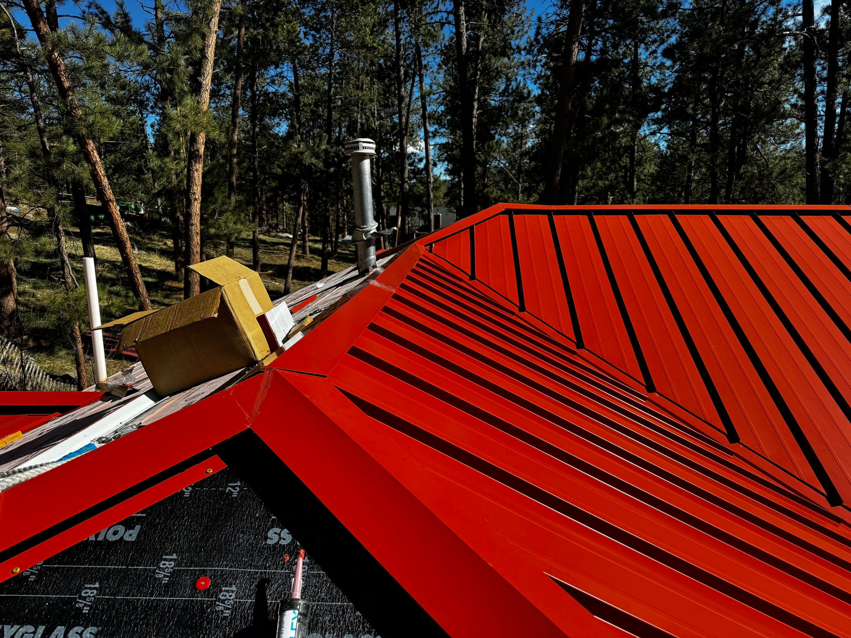Residential Roofing Installation using Standing Seam Metal by Blue Peaks Roofing LLC 