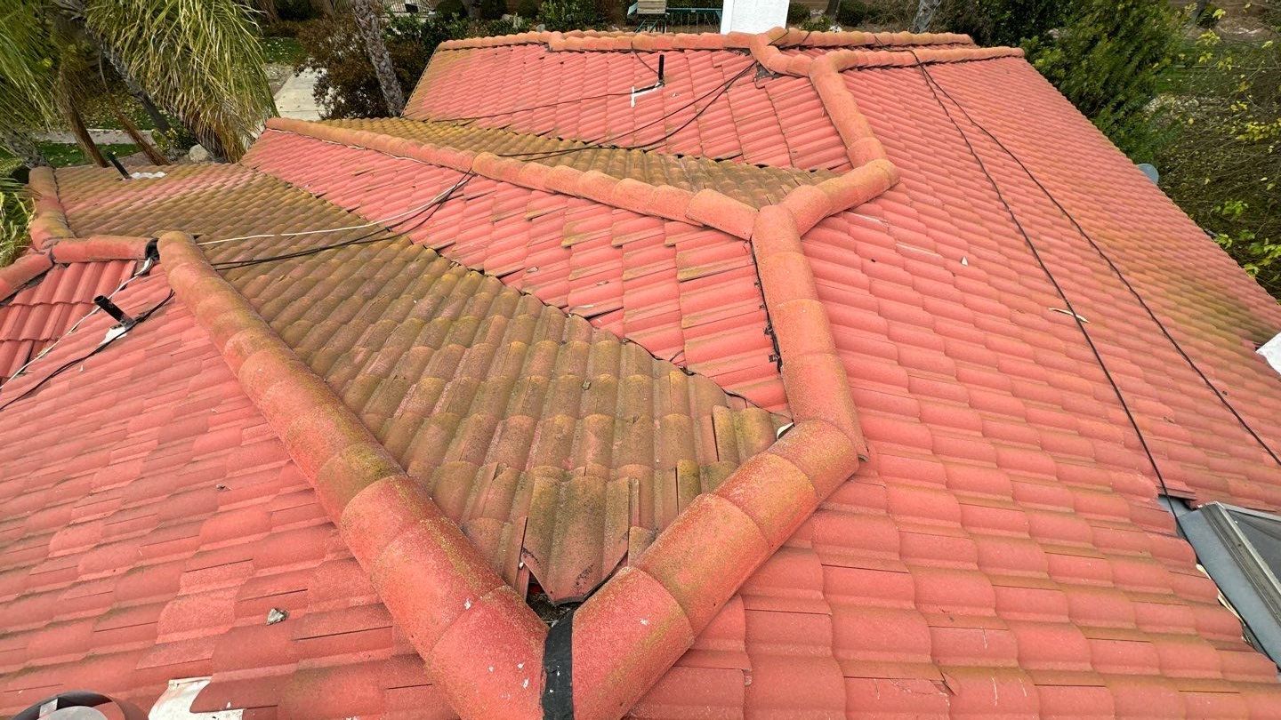 Tile refurbish project using existing tiles and replaced underlayment and battens by Straight Edge Roofing Inc