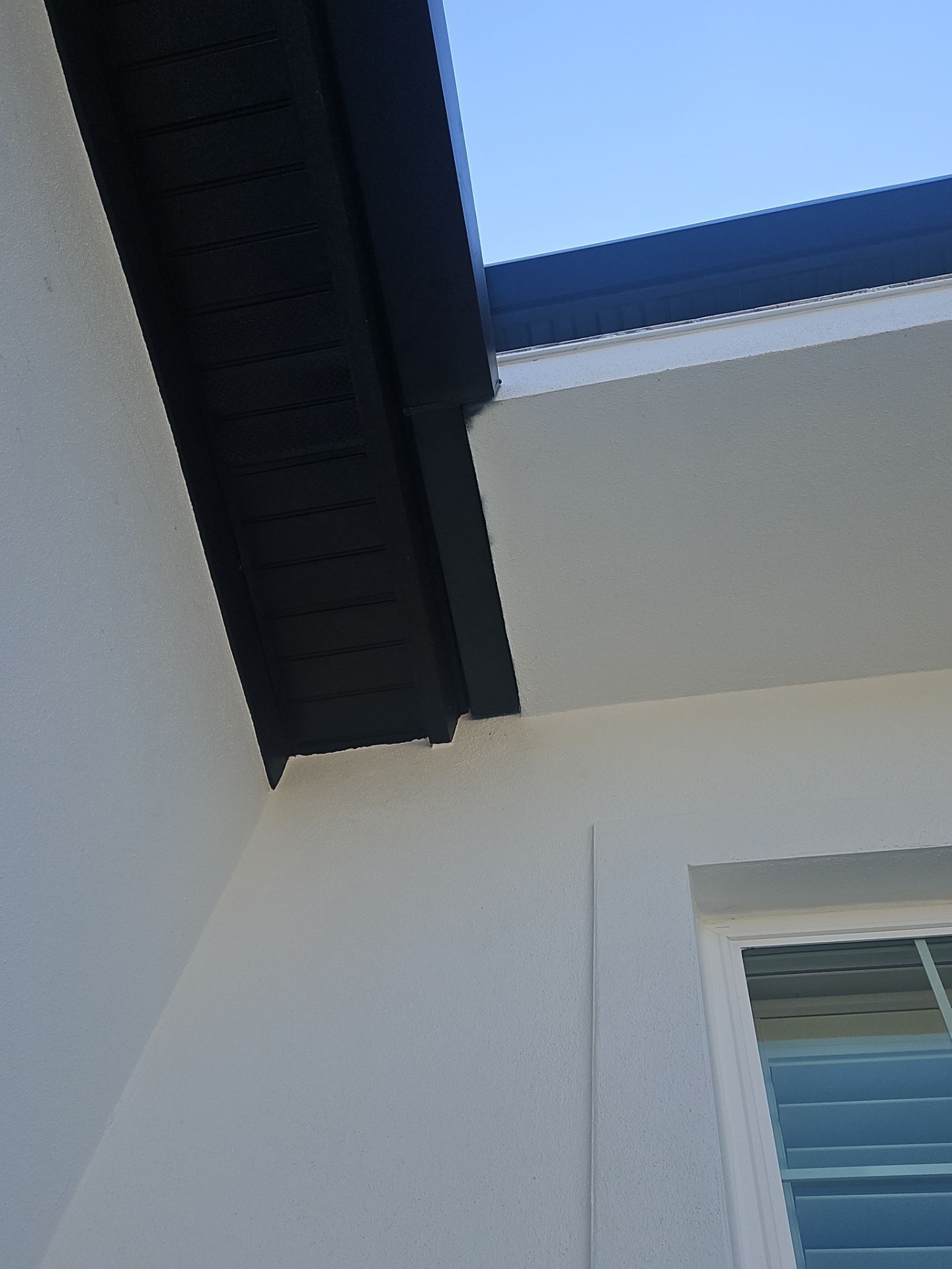 Soffit and Fascia Installation and black seamless gutters in Sarasota FL by Gutter Professors