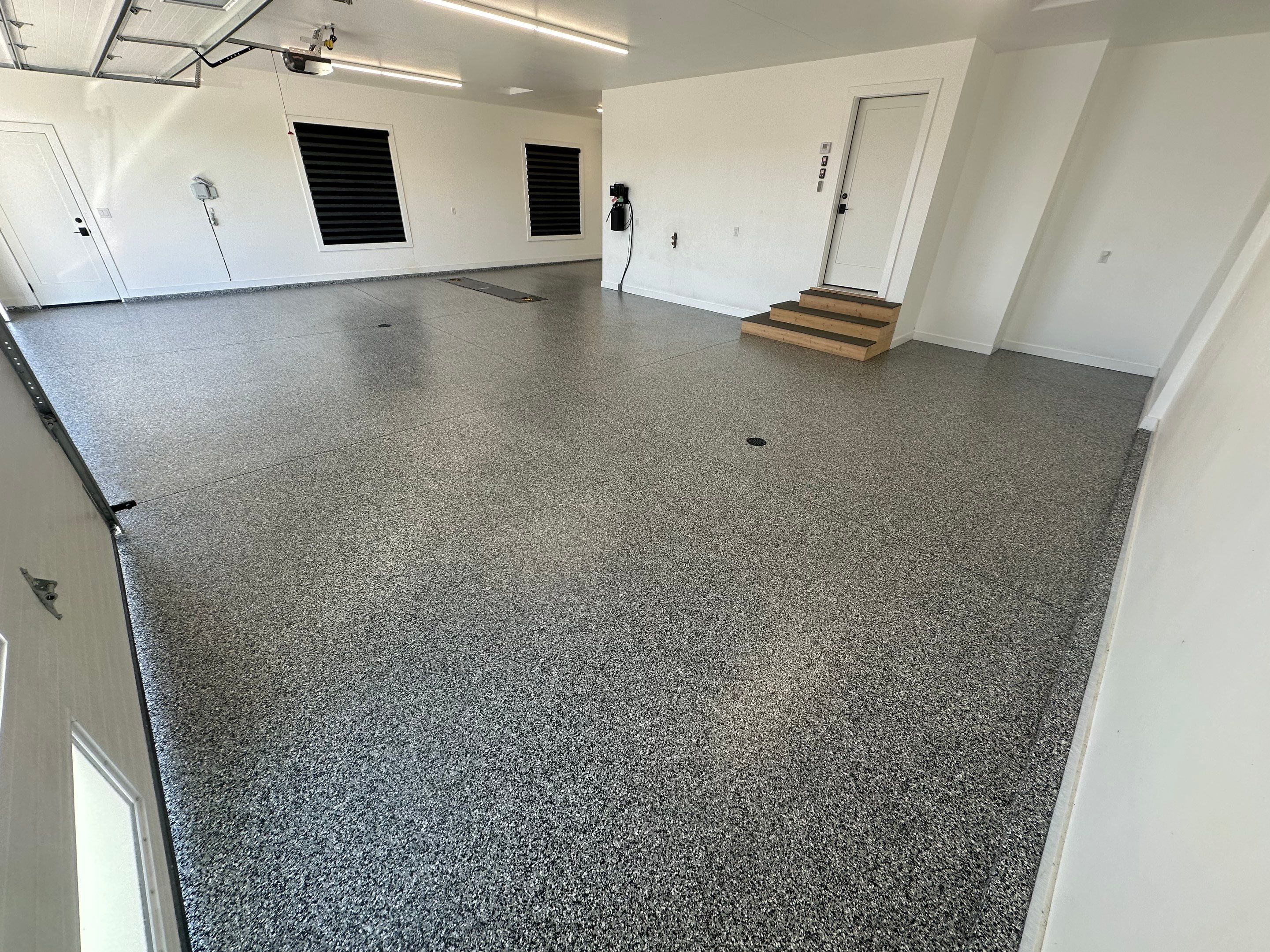 Multi-Color Epoxy Flake Garage Floor Installation in Sioux Falls by Select Painting, Coatings & Garage Cabinets
