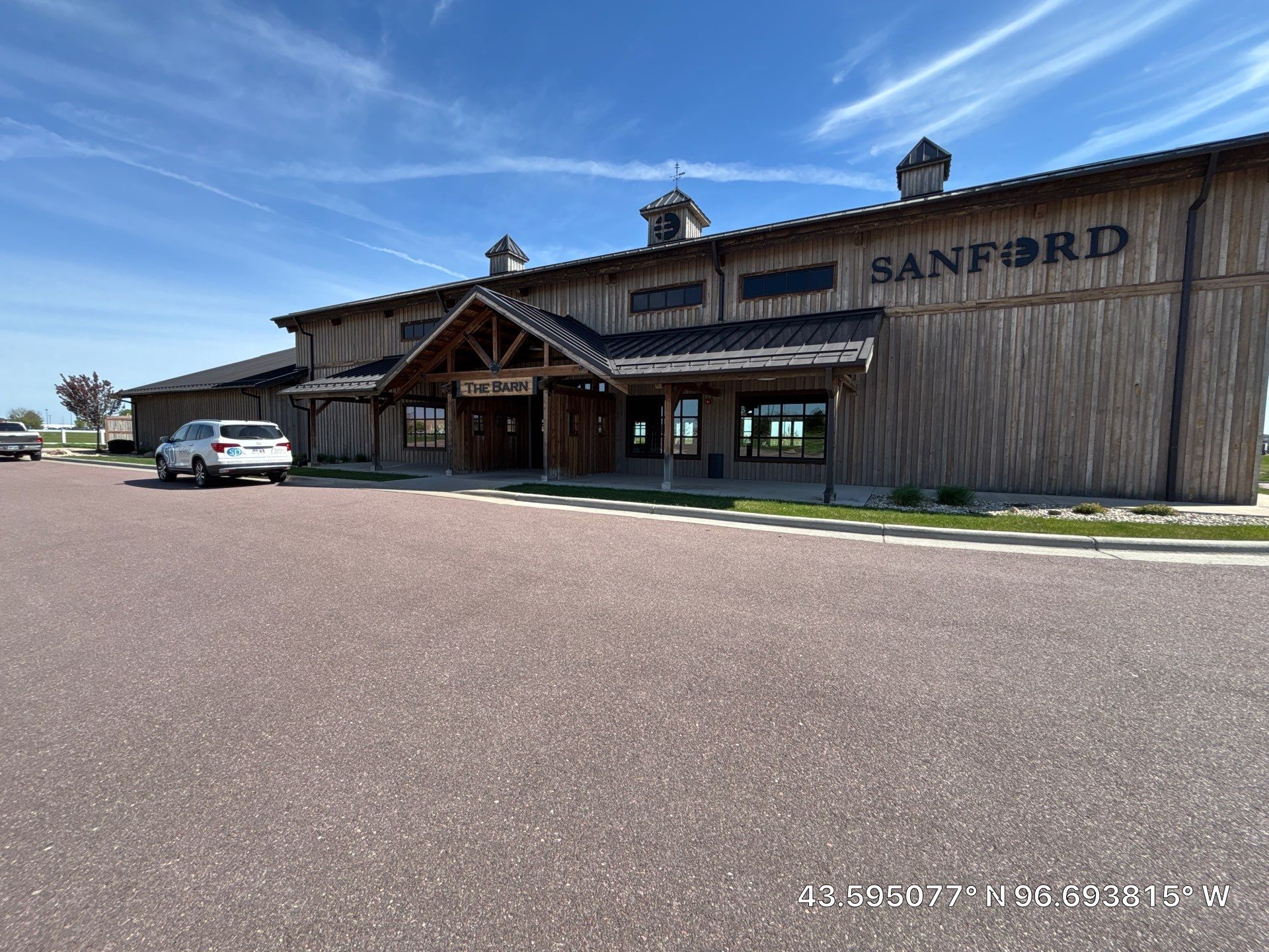 Commercial Exterior Wood Staining for Sanford Barn in Sioux Falls by Select Painting, Coatings & Garage Cabinets