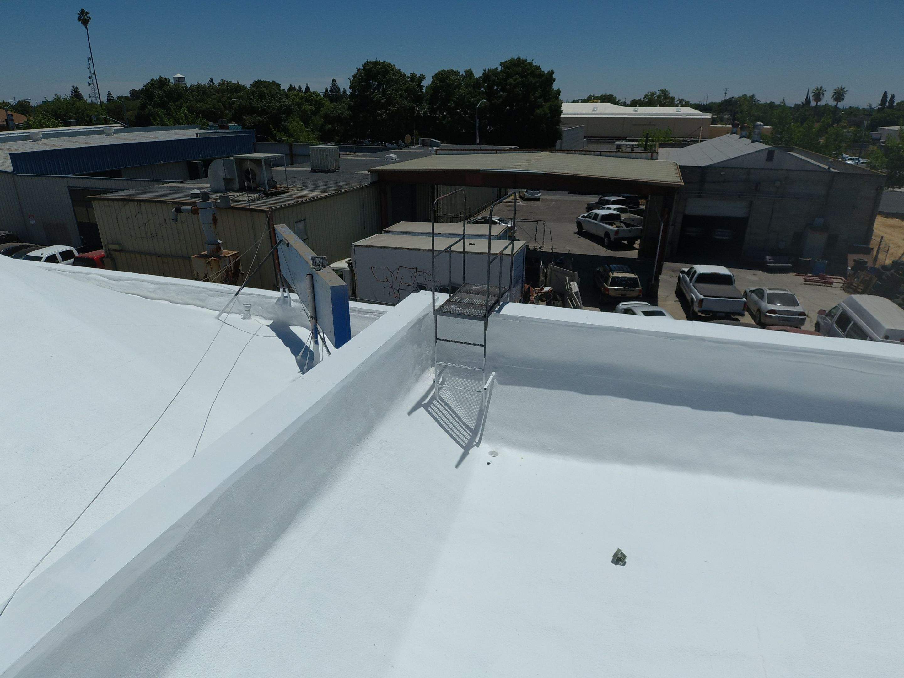 Spray foam and coatings using Conklin Benchmark/PUMA XL coatings and spray foam by Straight Edge Roofing Inc