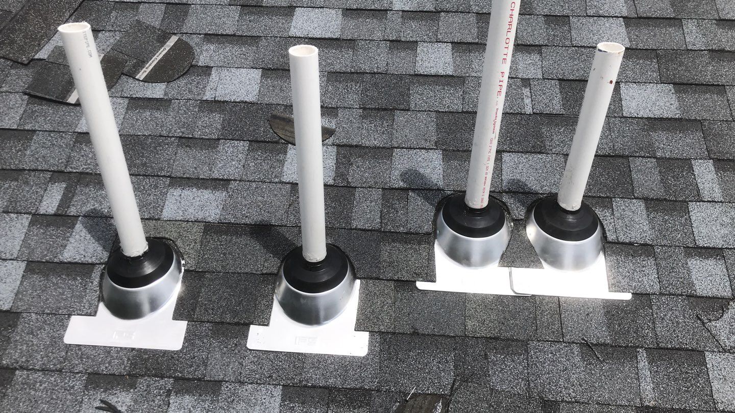 Commercial Roofing Installation using EPDM with white gutters by A Plus Exterior