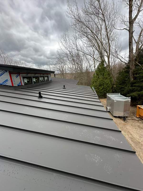 Residential Roofing Installation using 24 Ga Standing Seam Metal by Jay Carter Roofing & Sheet Metal