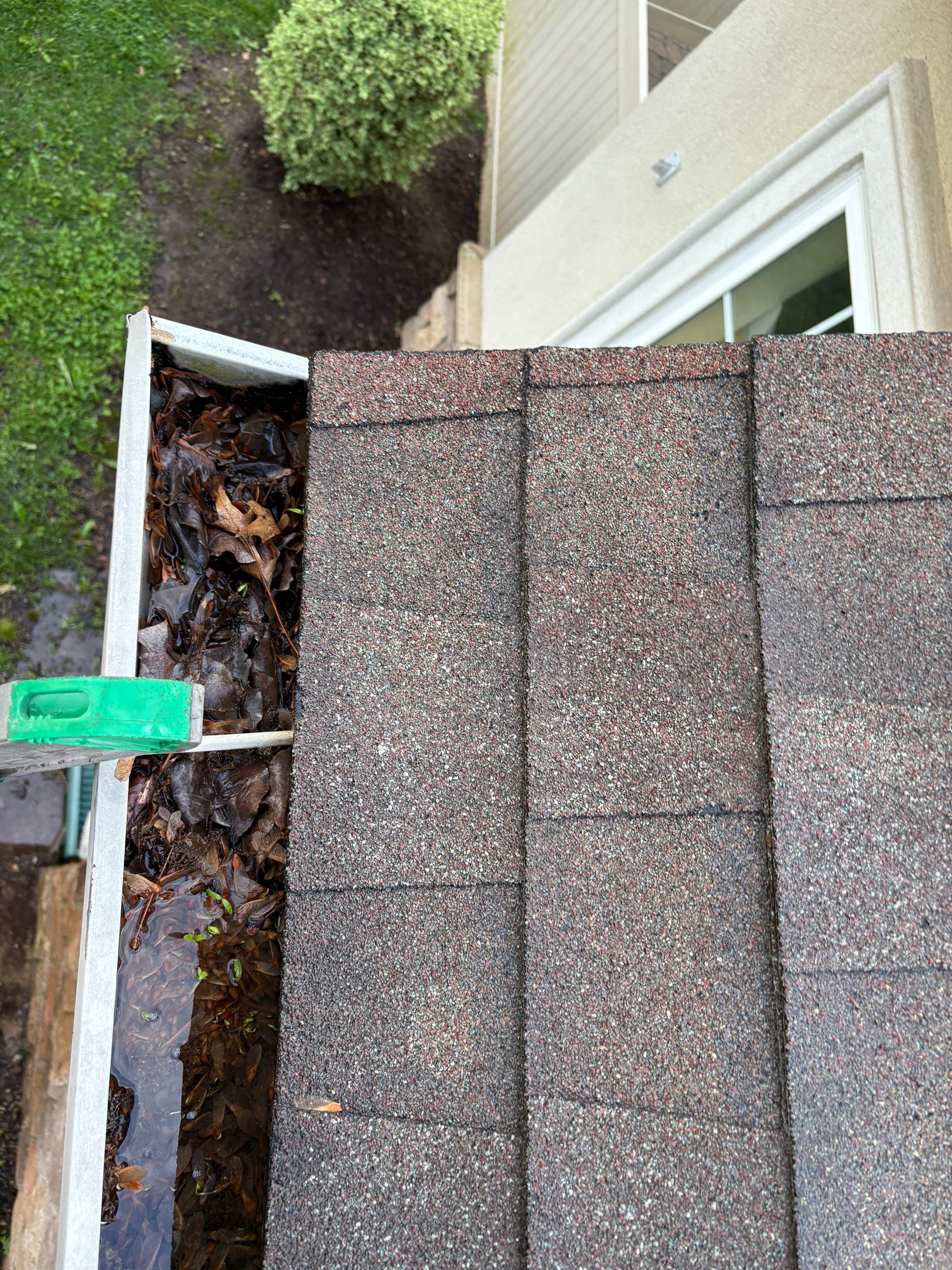 Commercial gutter cleaning Edison & New Brunswick before photo with filled gutters