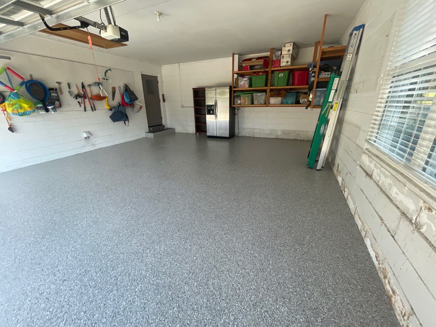 Garage with Cabinets in Gainesville, FL in Mount Everest by Cross Creek Concrete Coatings