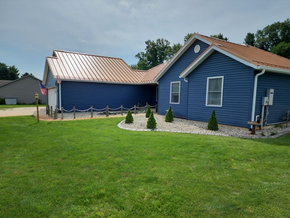 Residential Roofing and Siding Installation using Copper Penny Standing Seam by 4Ever Metal Roofing