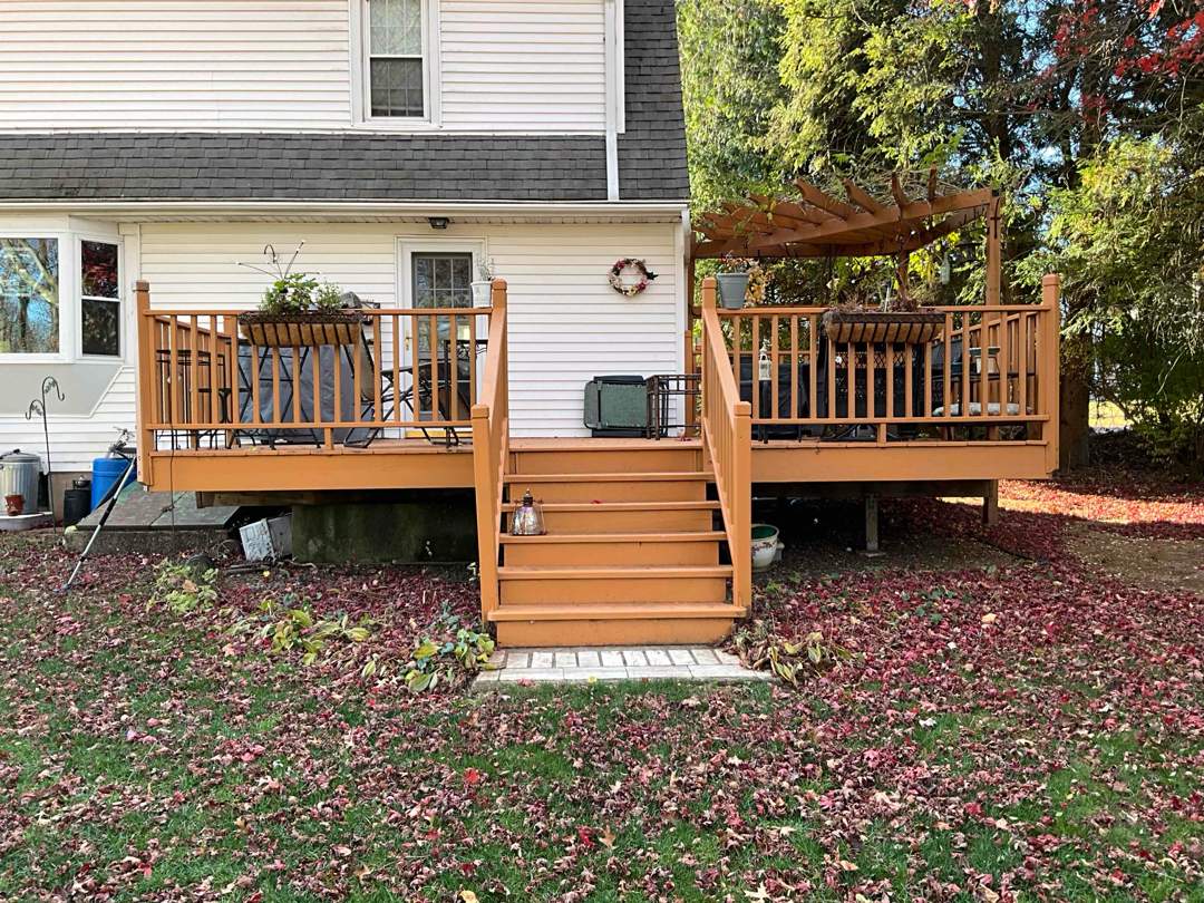 Replacement deck with Trex Transcend Tiki Torch deck boards and matching cocktail rail. by DiGiorgi Roofing and Siding Inc