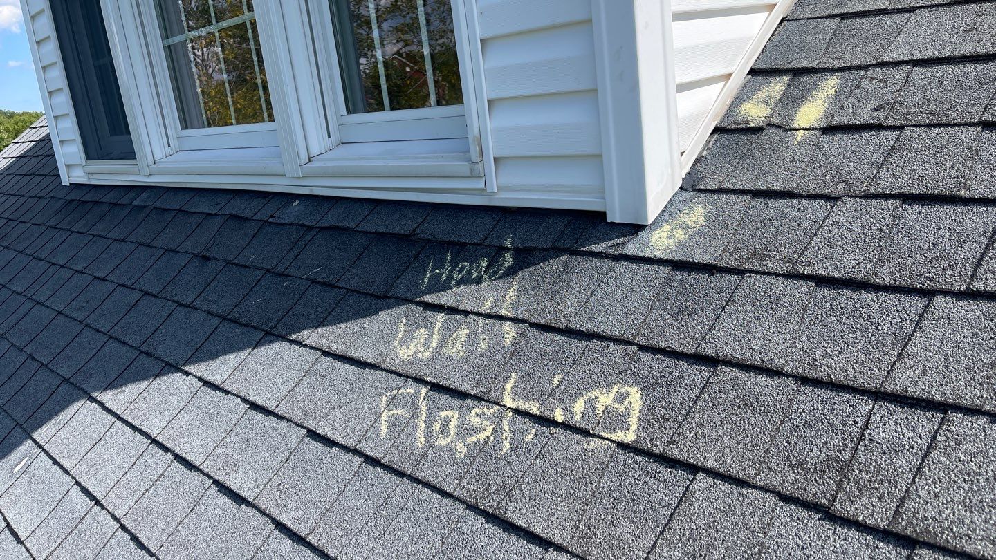 Roof Damage using Certainteed Lifetime Roofing System- Moire Black Landmark Pro shingkes with shadow ridge caps. by BulletpROOF Exteriors