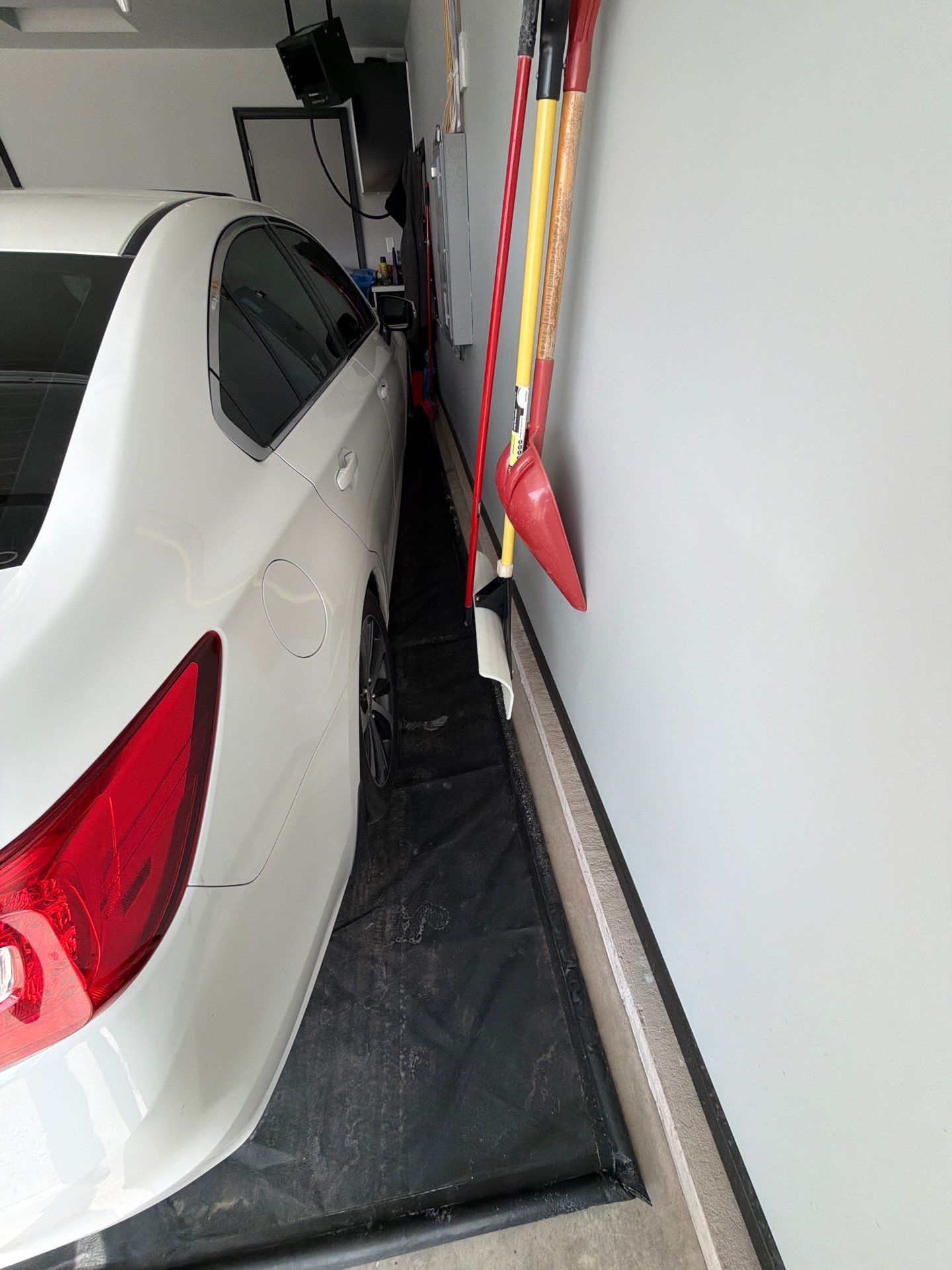Custom Epoxy Garage Floor Coating Installation in Sioux Falls by Select Painting, Coatings & Garage Cabinets