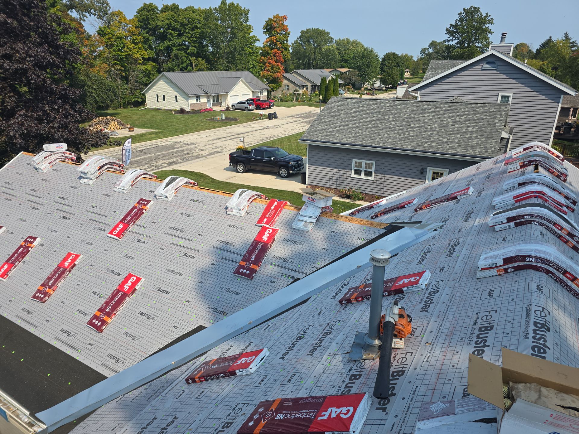 Residential Roof Installation in Sheboygan Falls, WI: GAF Timberline Natural Shadow Shingles & Rain Drop Gutter Protection by Gellings Roofing & Siding