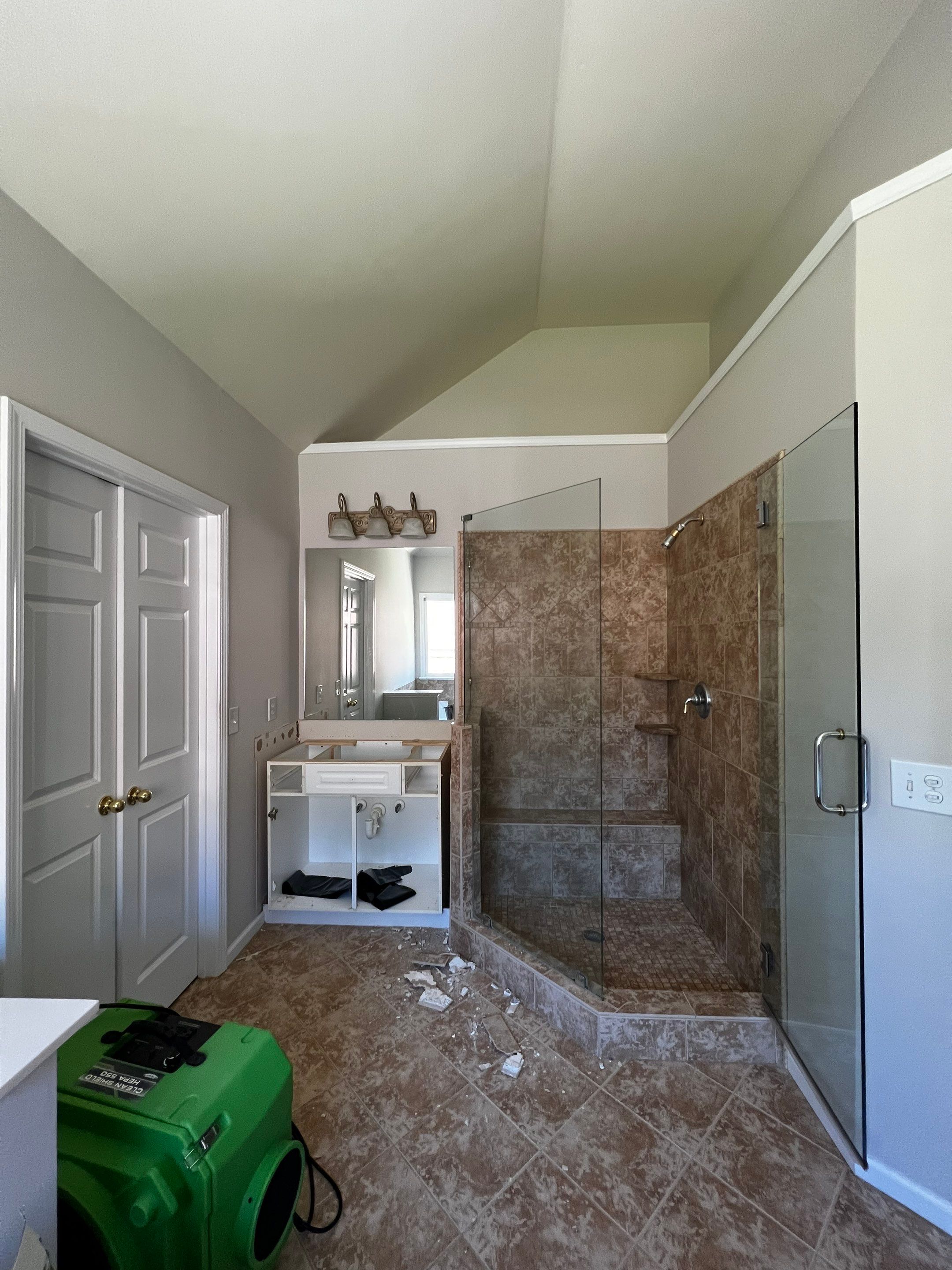 Master Bathroom Renovation with Marble Floor and Freestanding Soaking Tub by Swift Home Renovations