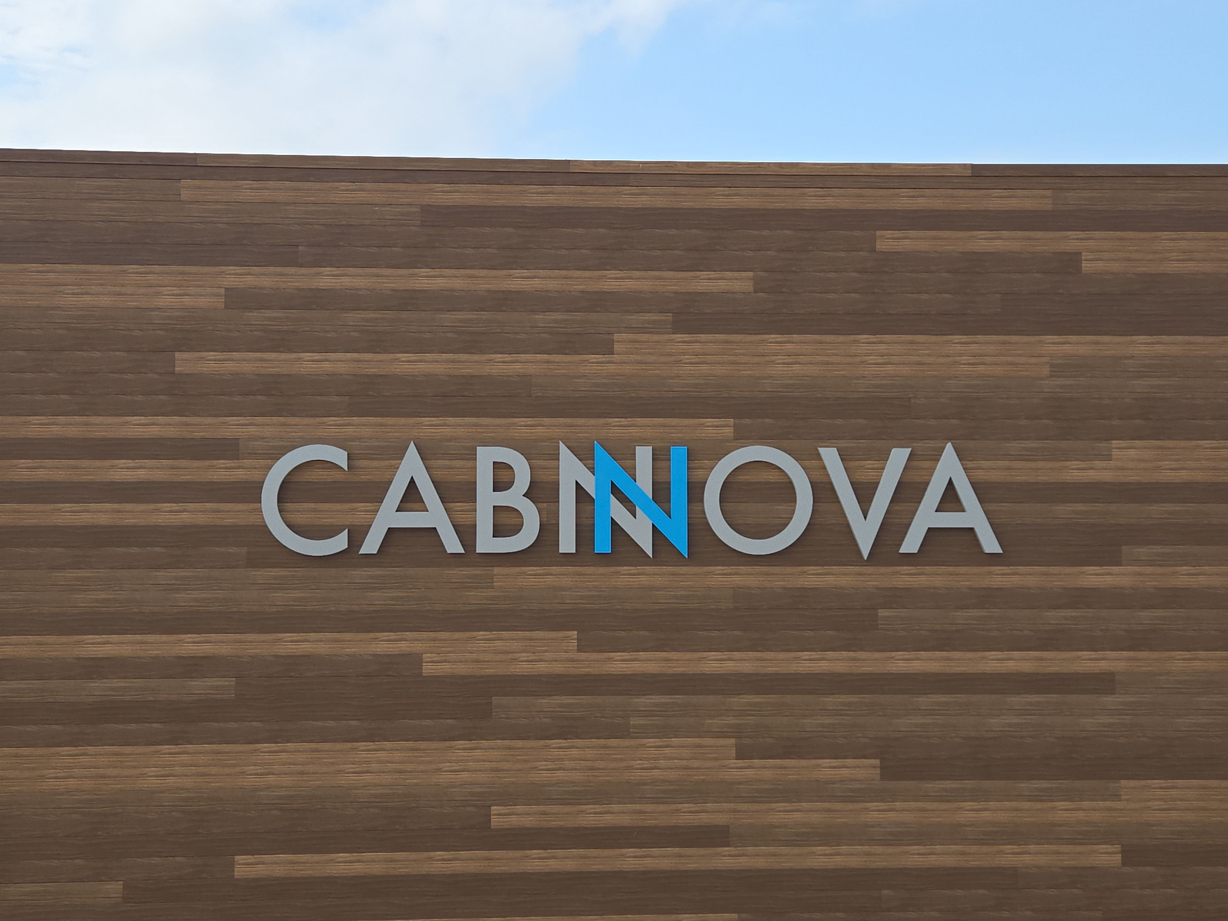 Custom Cabnova Metal Lettering and Wood-Look Panel Installation in Bremen by Hayes Design co