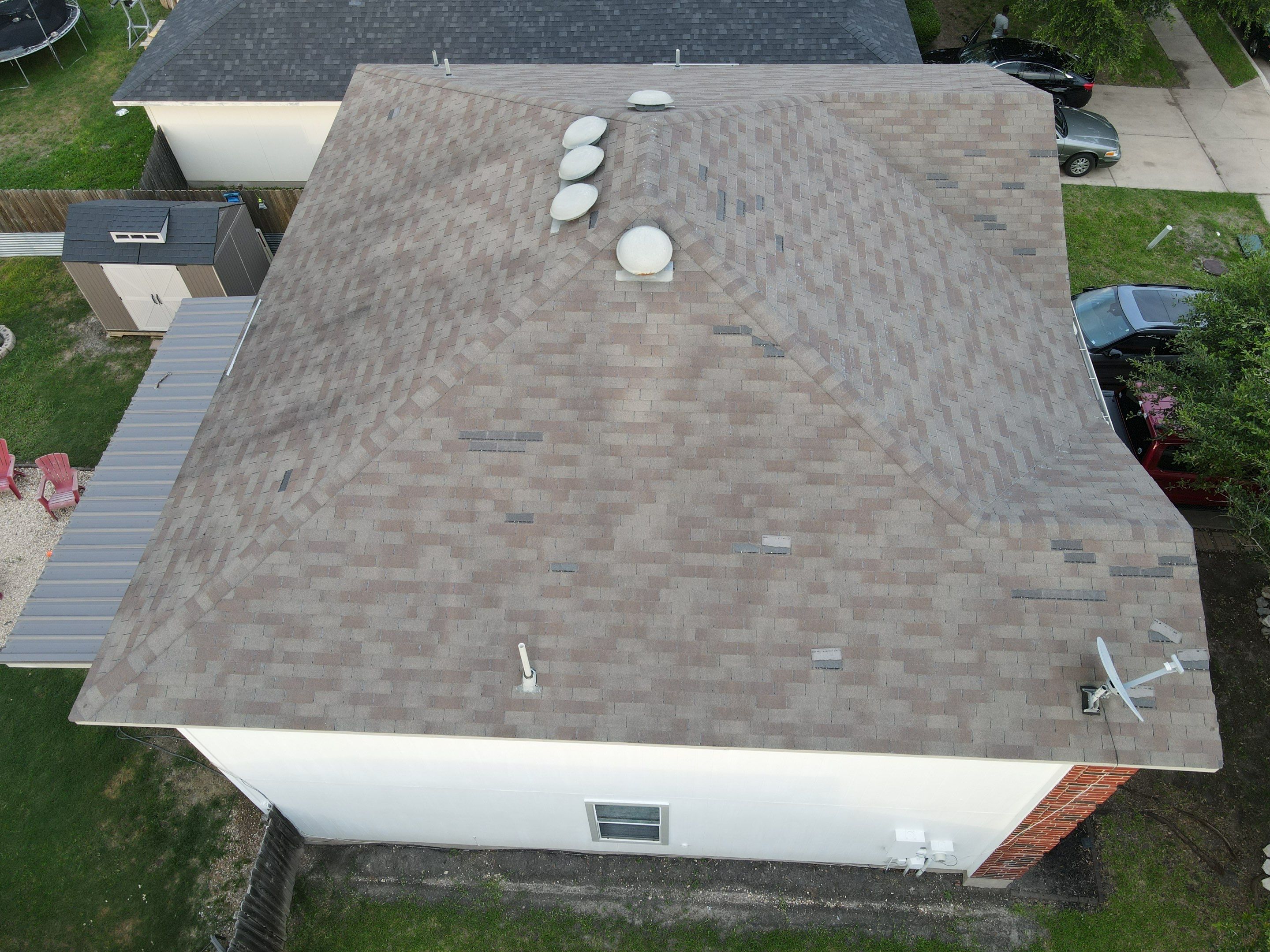 Residential Roofing Replacement and Gutter Installation in Manor by Caliber Restoration LLC