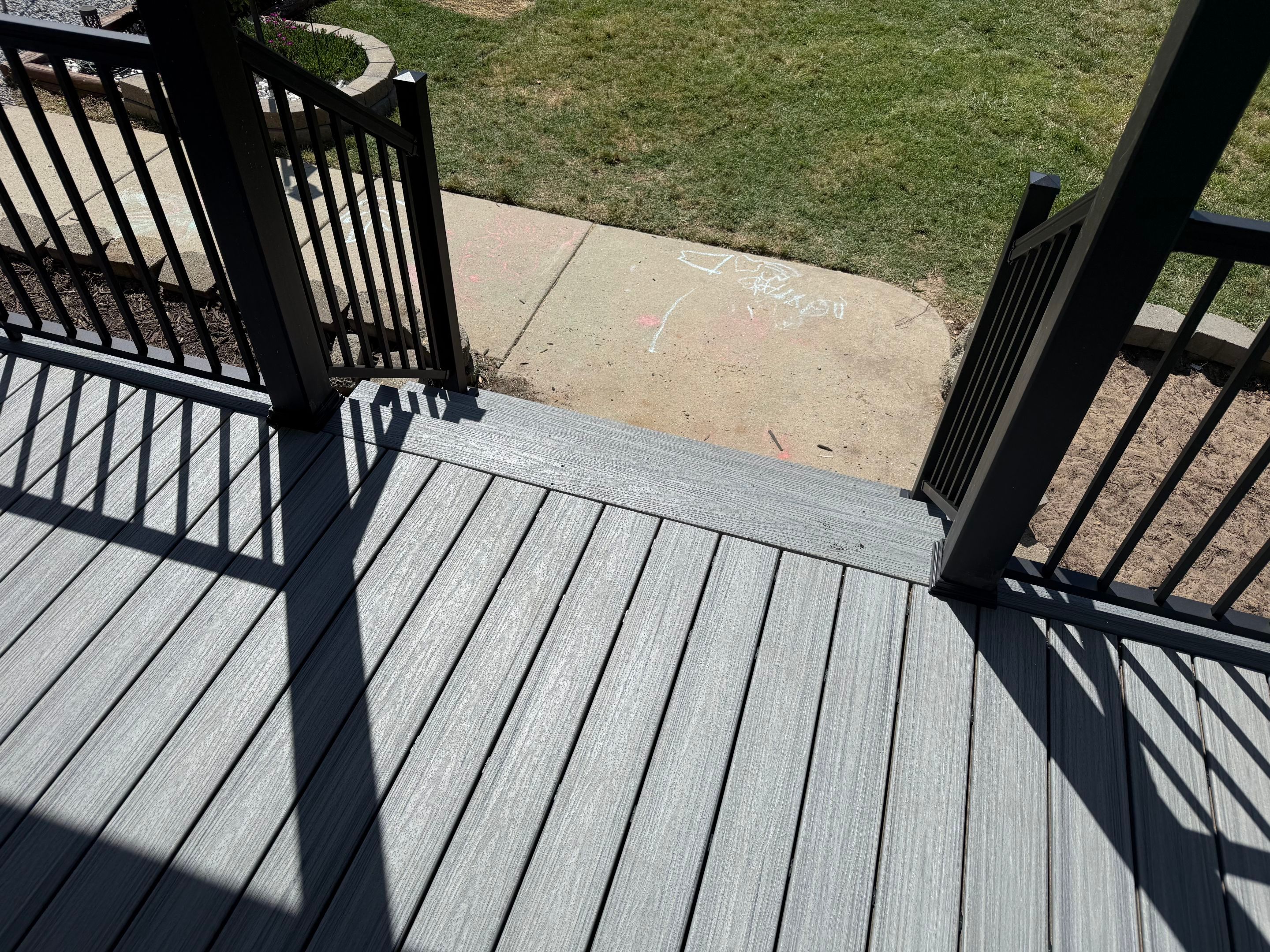 Willow Spring Composite Deck Resurface and Black Railing Upgrade by The Remodeling Company