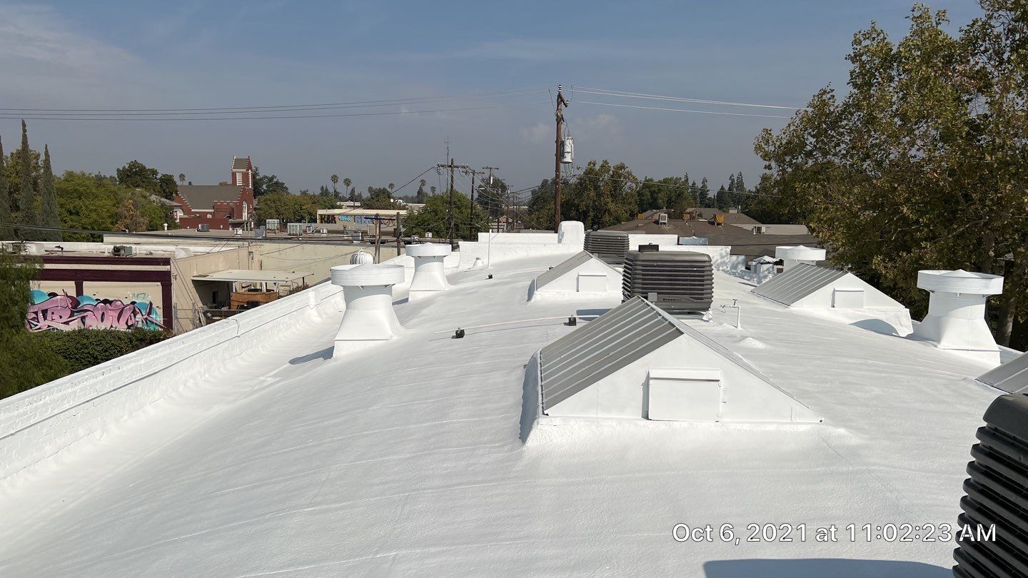 Polyurethane foam roof refurbish and recoating by Straight Edge Roofing Inc