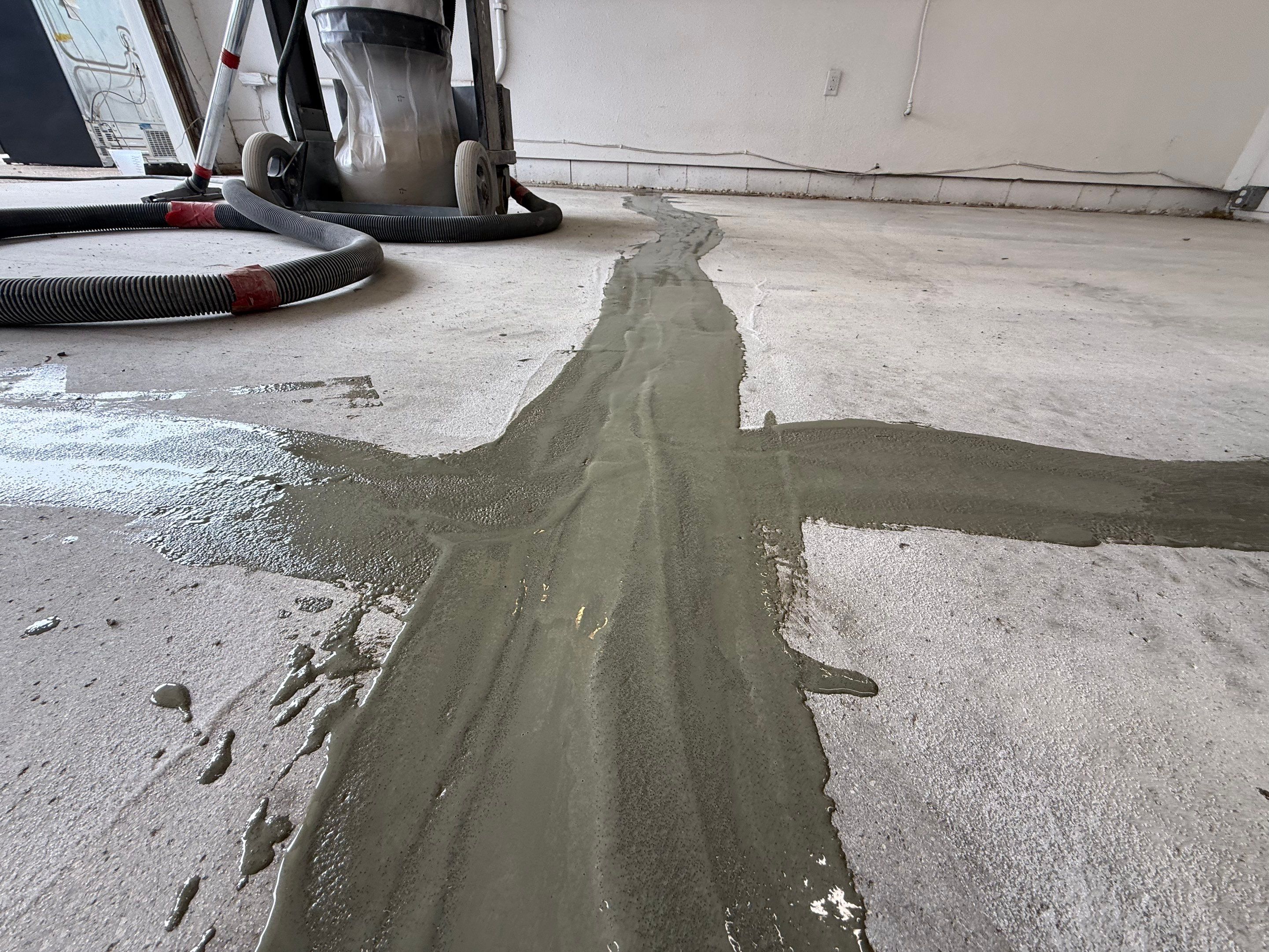 Feather Grey Garage Floor Coating and Crack Repair in Beresford by Select Painting, Coatings & Garage Cabinets