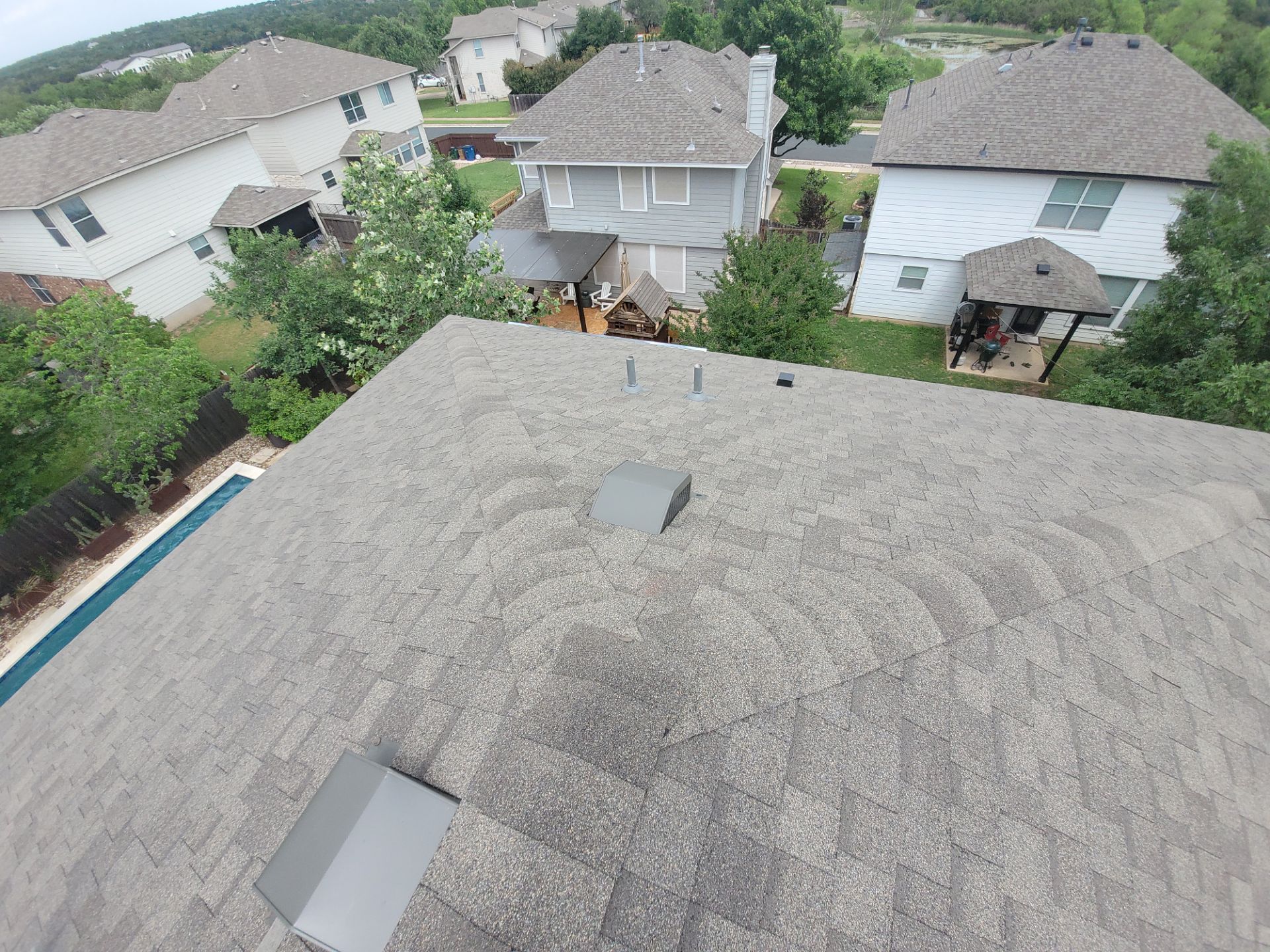 Residential Roofing Installation using IKO, Cambridge and gutters by Oakwood Roofing and Construction, LLC