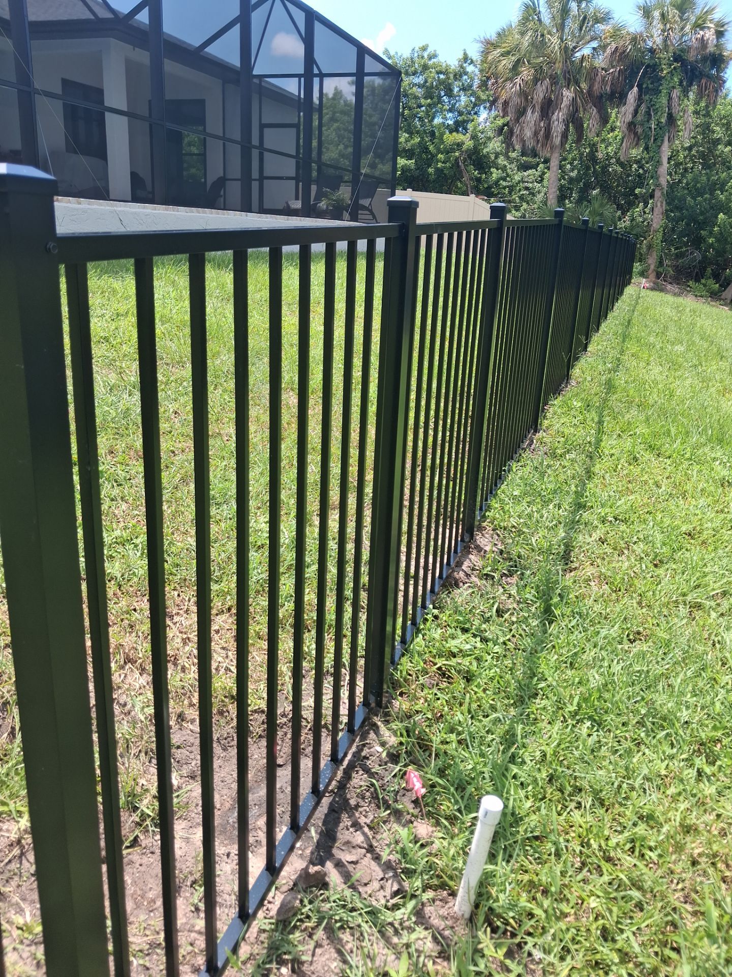 Vinyl Privacy Fencing and Aluminum Pool Security Installation in Port Charlotte by True Fence LLC
