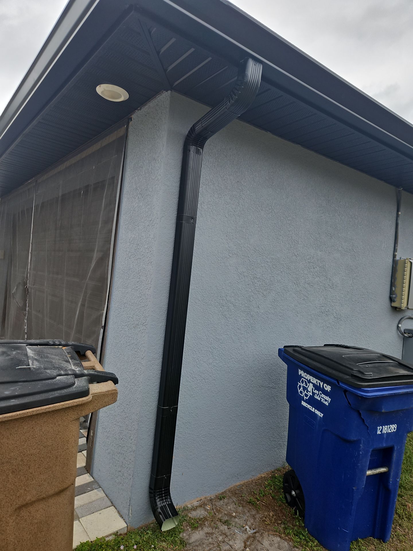Black Seamless Gutters & Soffit/Fascia in Lehigh Acres FL by Gutter Professors