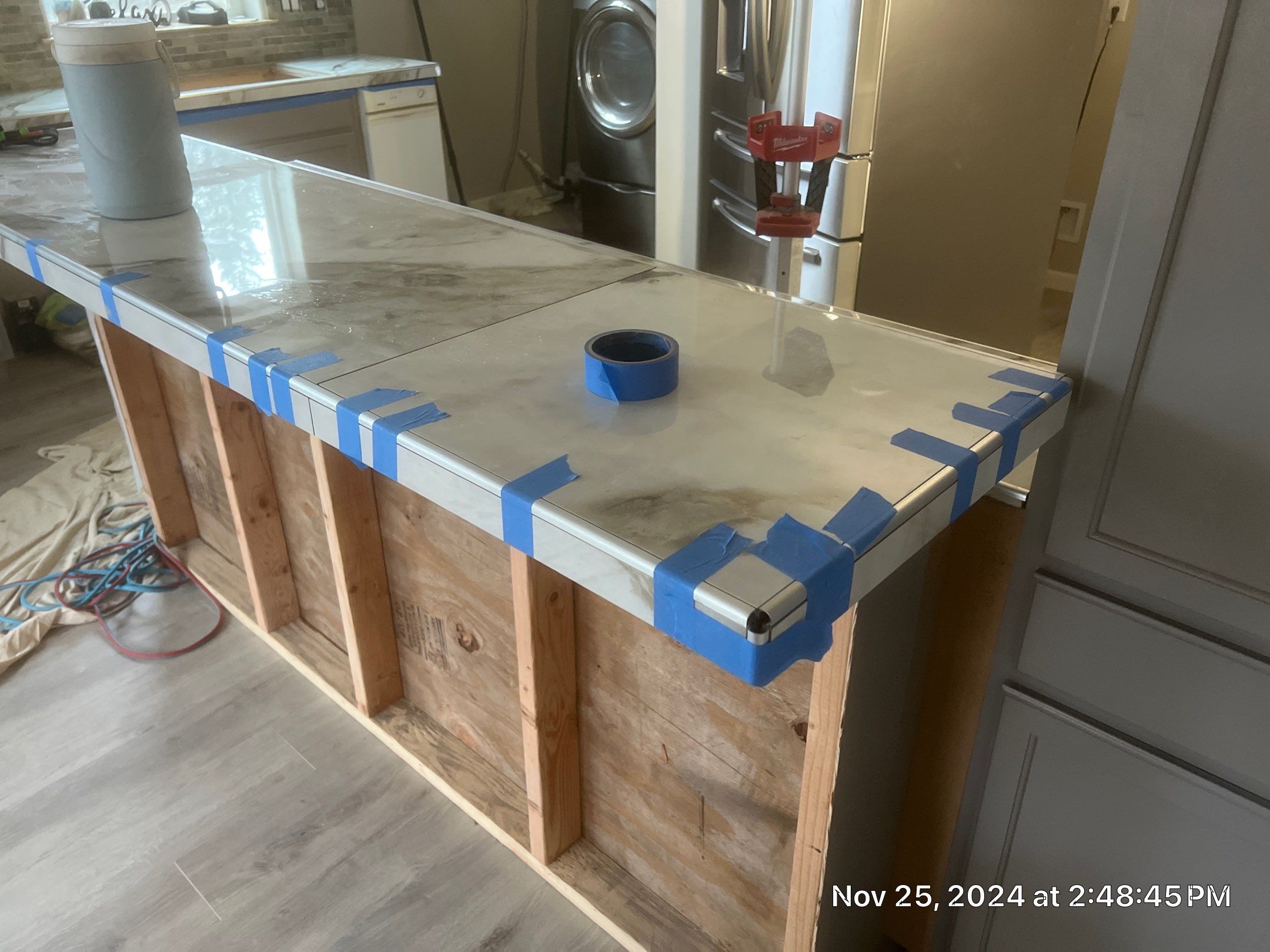 Marble Look Countertop and Stone Tile Backsplash Installation in Brookings by KMD Surfaces INC.