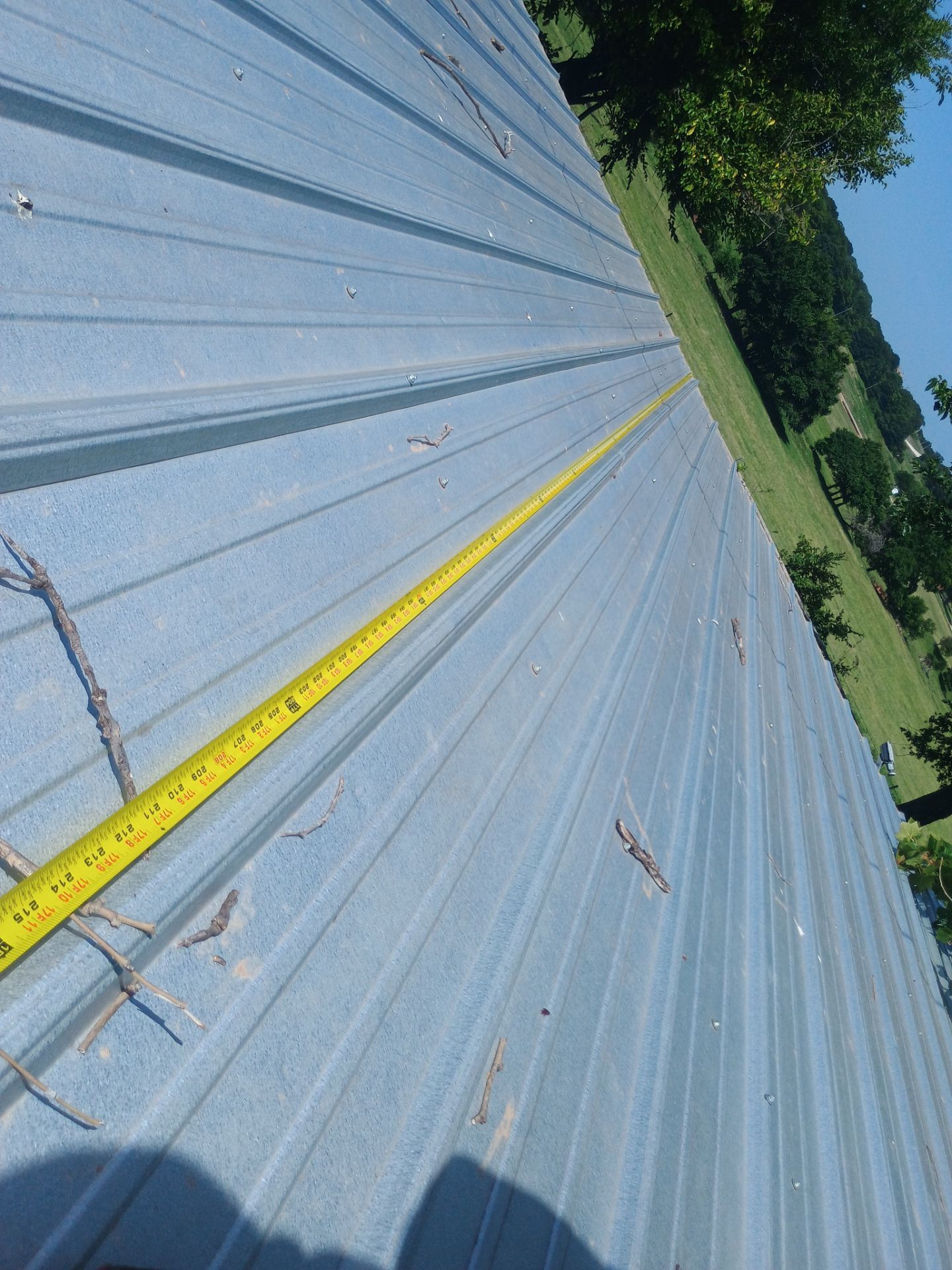 Corrugated Metal Roof Repair for Brick Home in Lindsay by BANA Roofing and Solar Supply