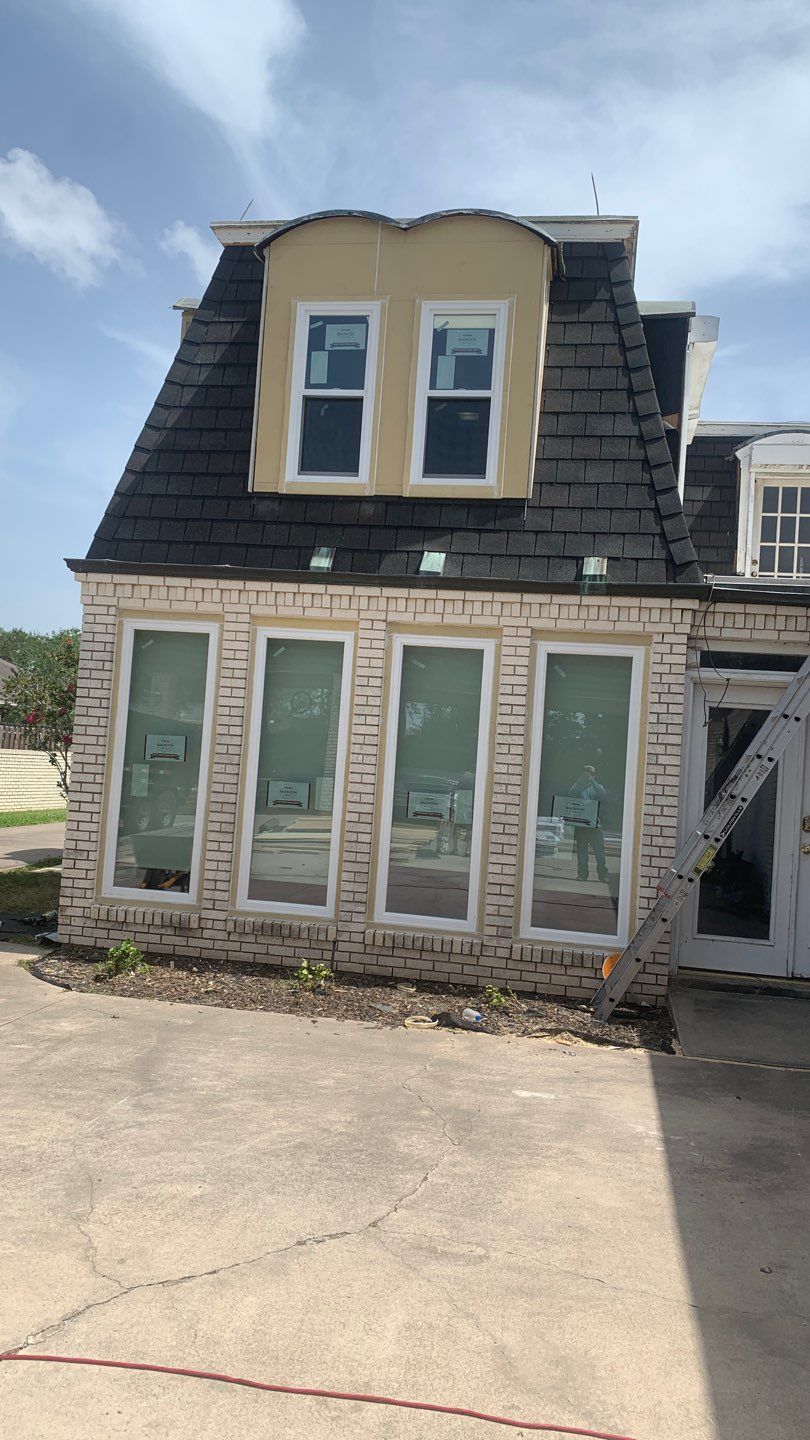 Mansard Charm by Bayfront Roofing and Construction