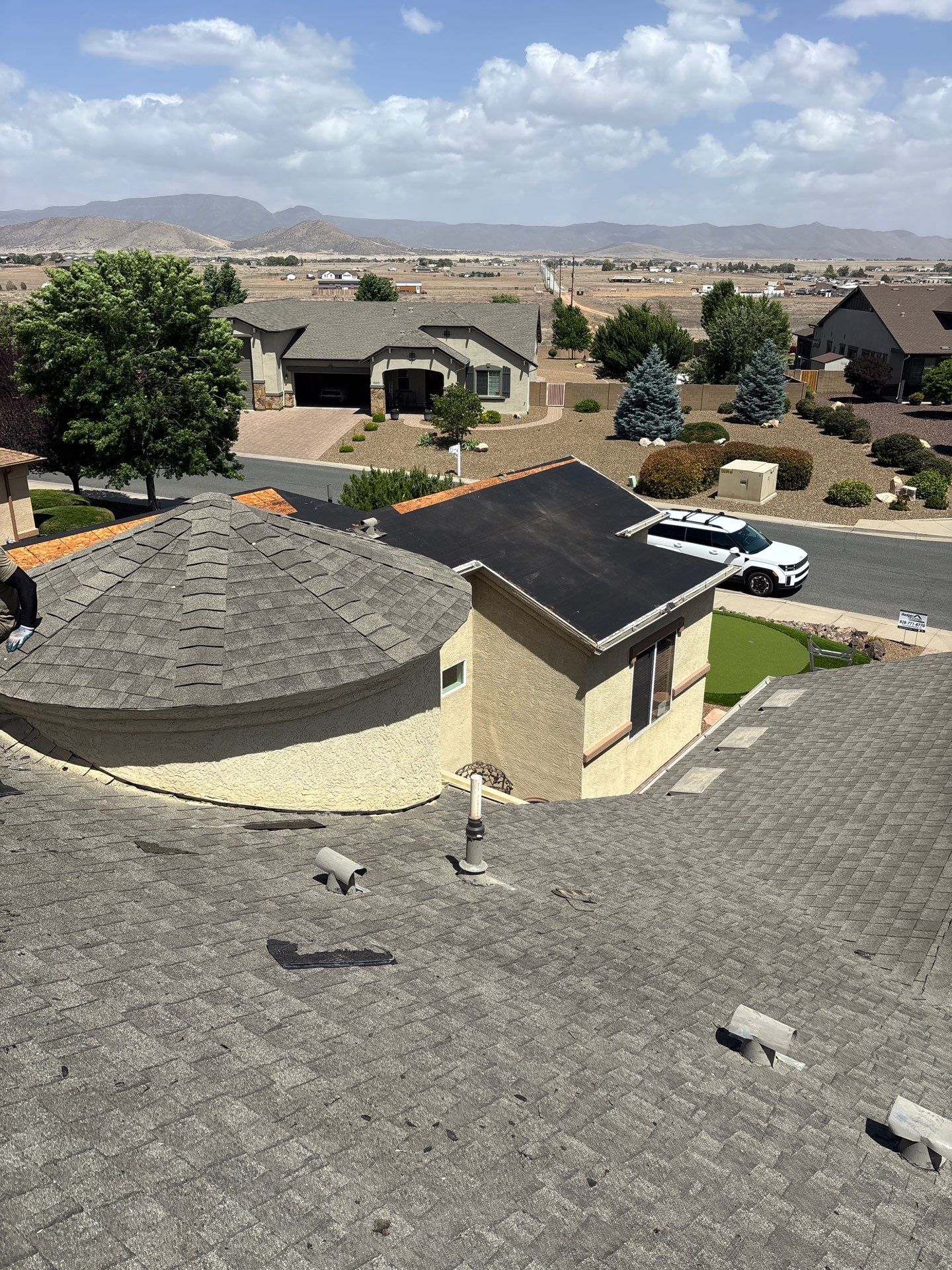 Residential Roofing Installation with Architectural Shingles and Turret Detail by Badger Roofing