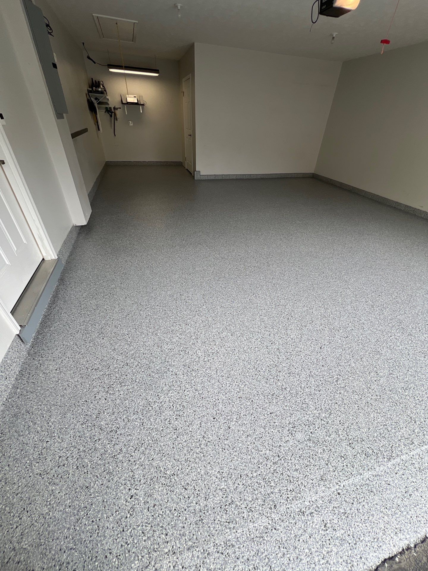 Silverado garage floor coating  by NG Masonry & Construction LLC