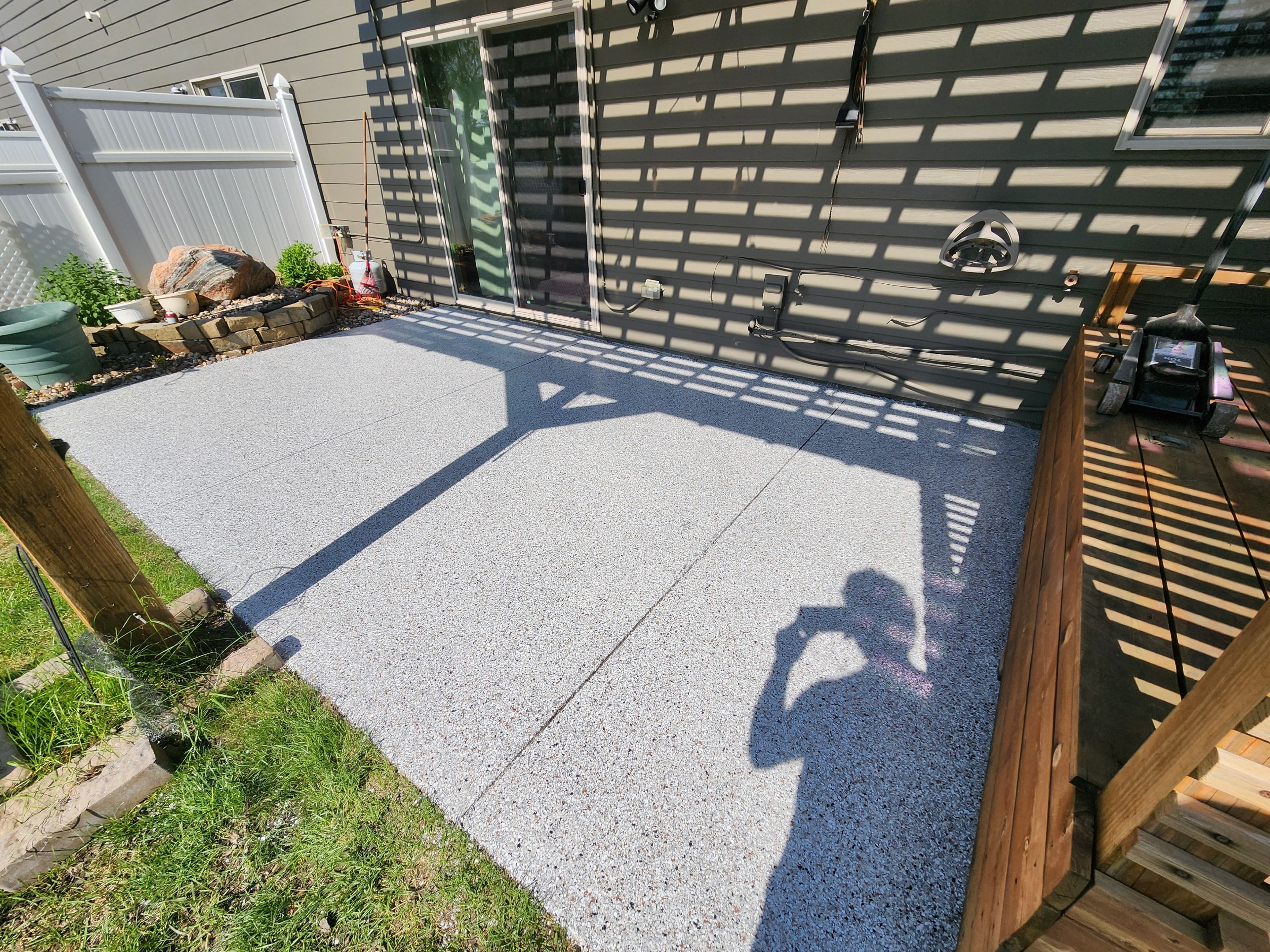 Coyote Flake Concrete Coating for Sioux Falls Patio by Select Painting, Coatings & Garage Cabinets