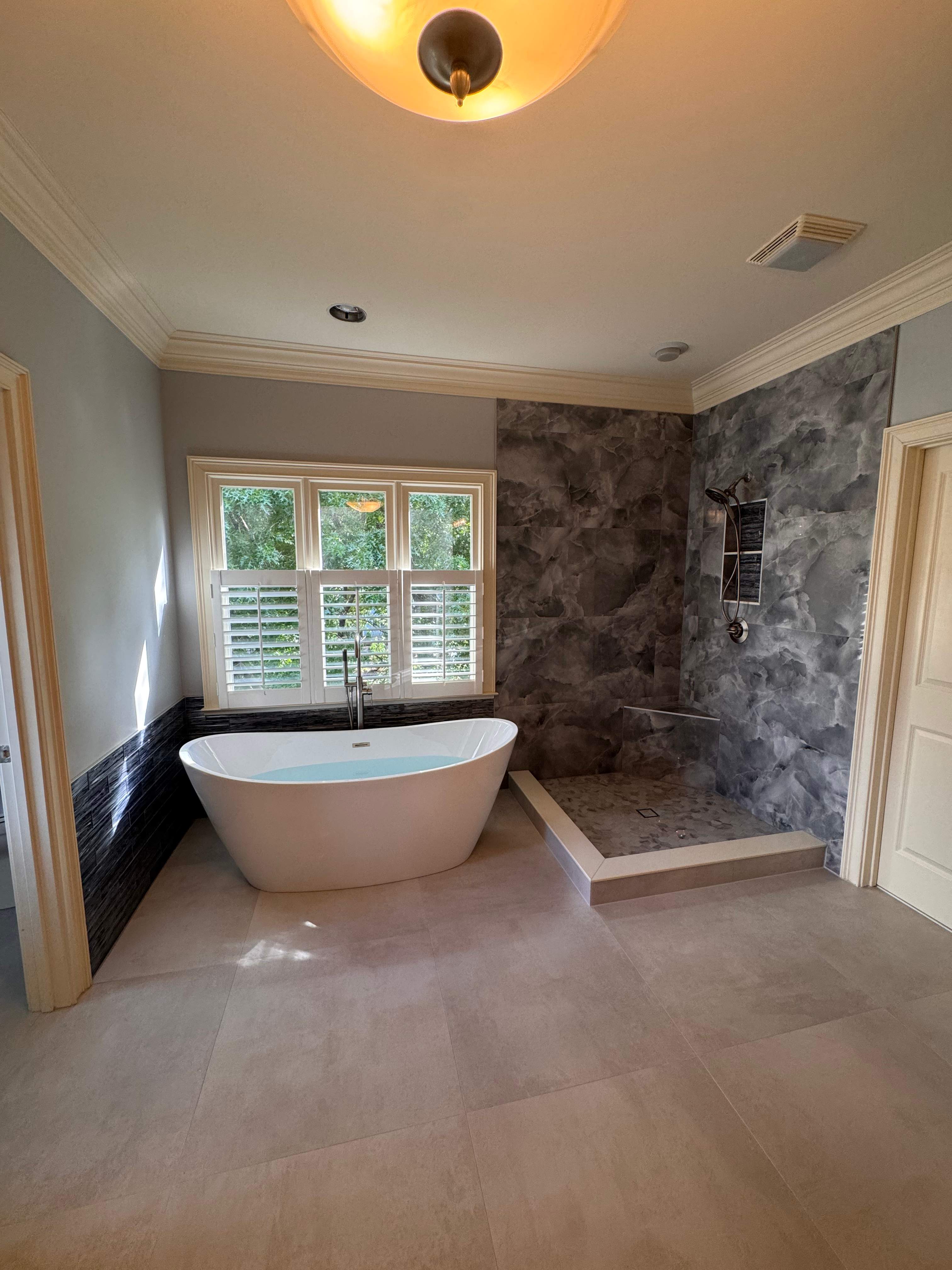 Master bathroom renovation using Free standing tub by Prudencio