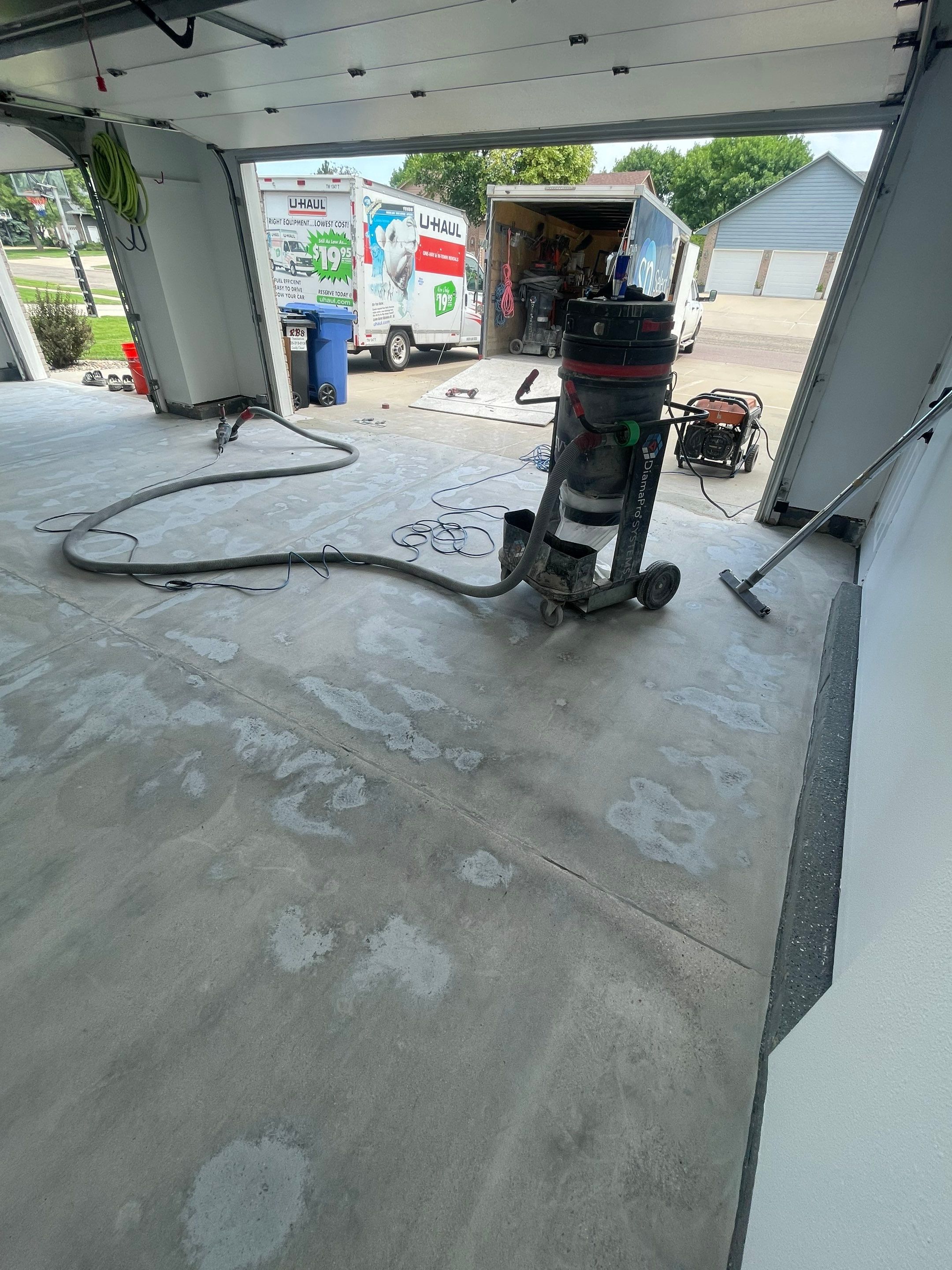 Multi-Car Garage Concrete Coating with Coyote Flake Finish in Sioux Falls by Select Painting, Coatings & Garage Cabinets