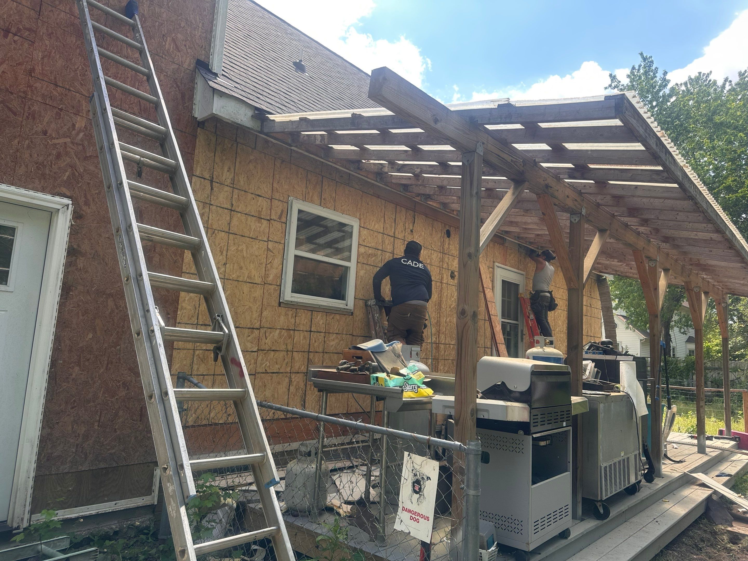 Gloucester Exterior Overhaul with Navy Blue Siding and New Roof by Cade Construction