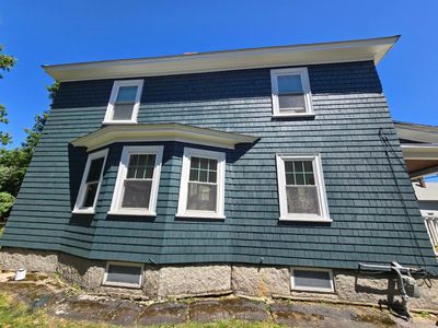 Siding replacement using cedar shakes
