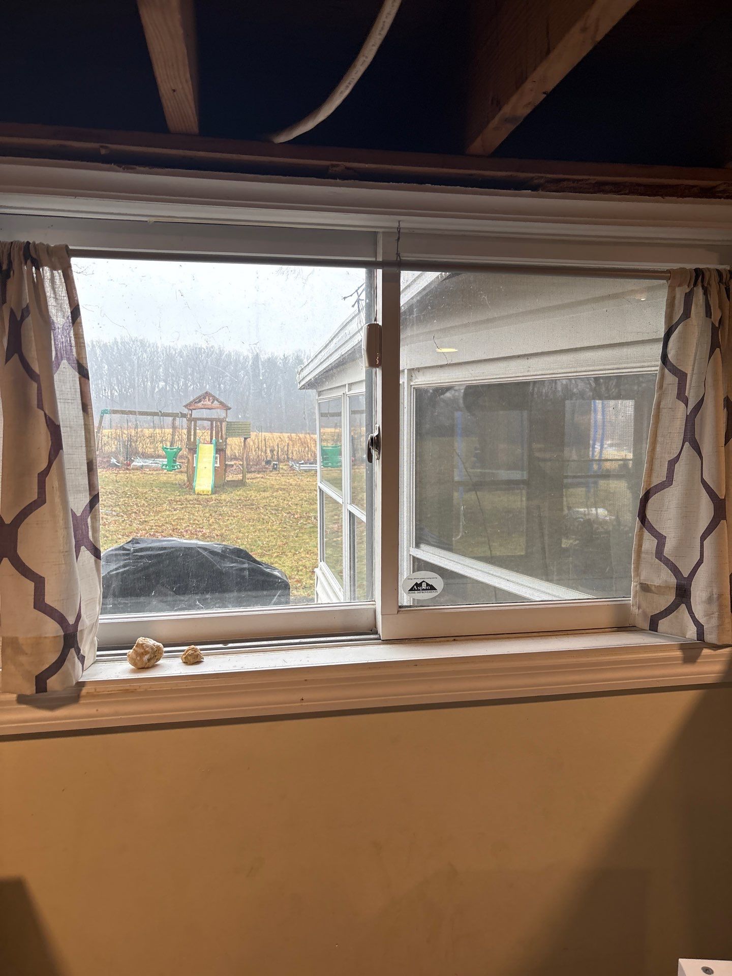 Storm Door and Basement Windows by Aspen Home Improvements