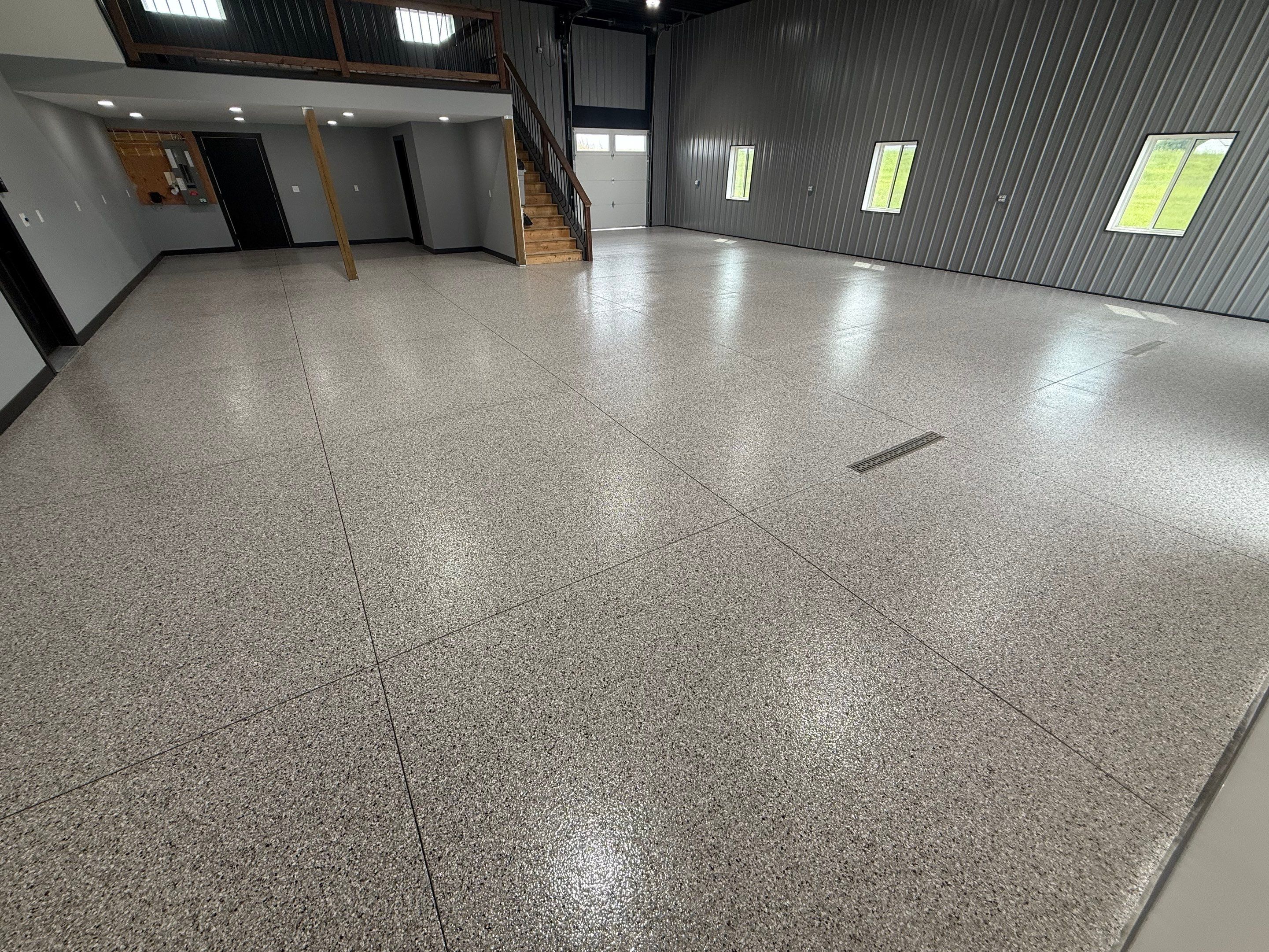 Polyaspartic Garage Floor Coating with Decorative Flake in Wentworth by Select Painting, Coatings & Garage Cabinets