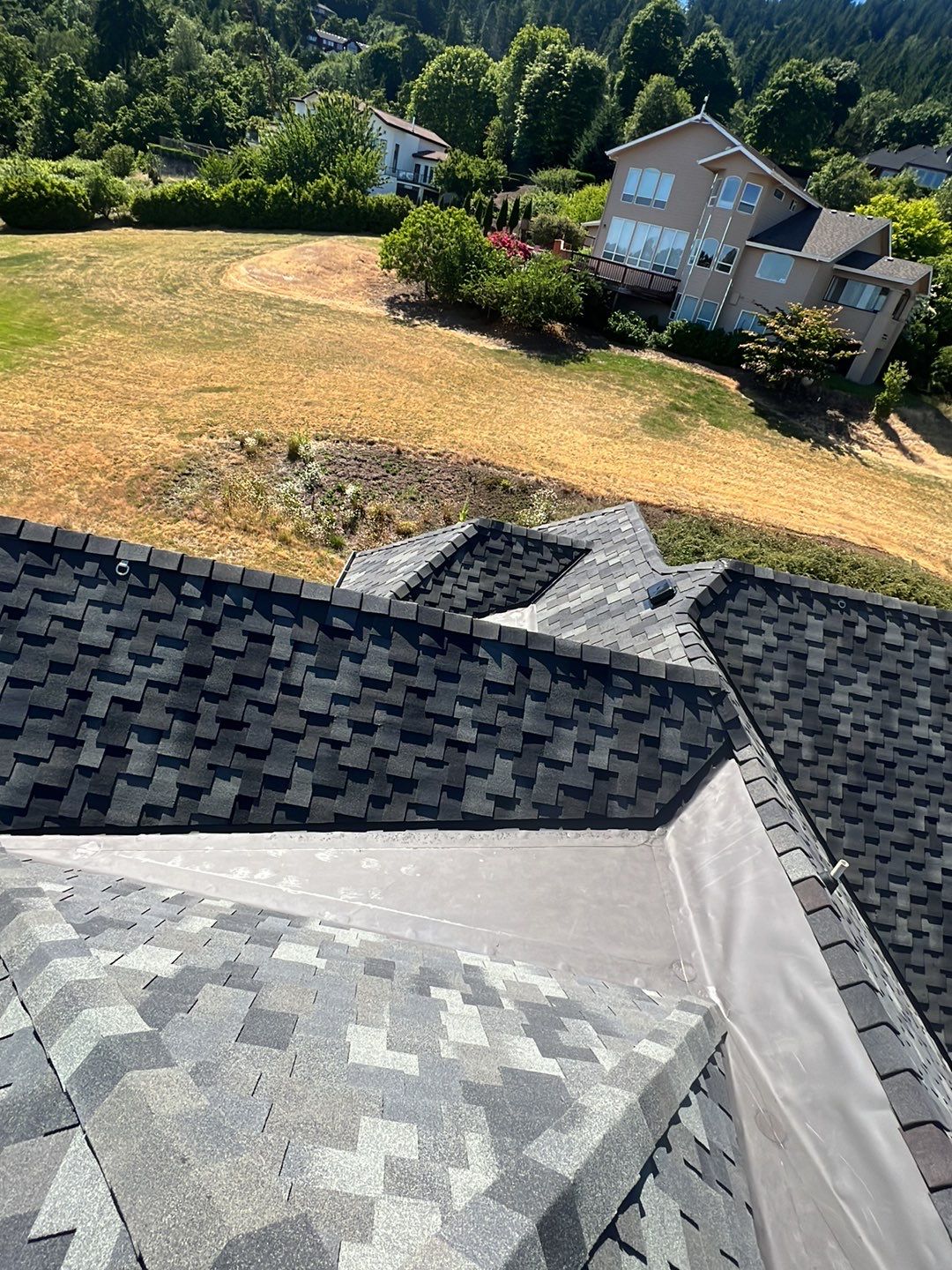 Residential Roofing Installation using Malarkey Windsor 50 Year Shingle (Color: Storm Grey) by Orezona Building & Roofing Company, Inc.