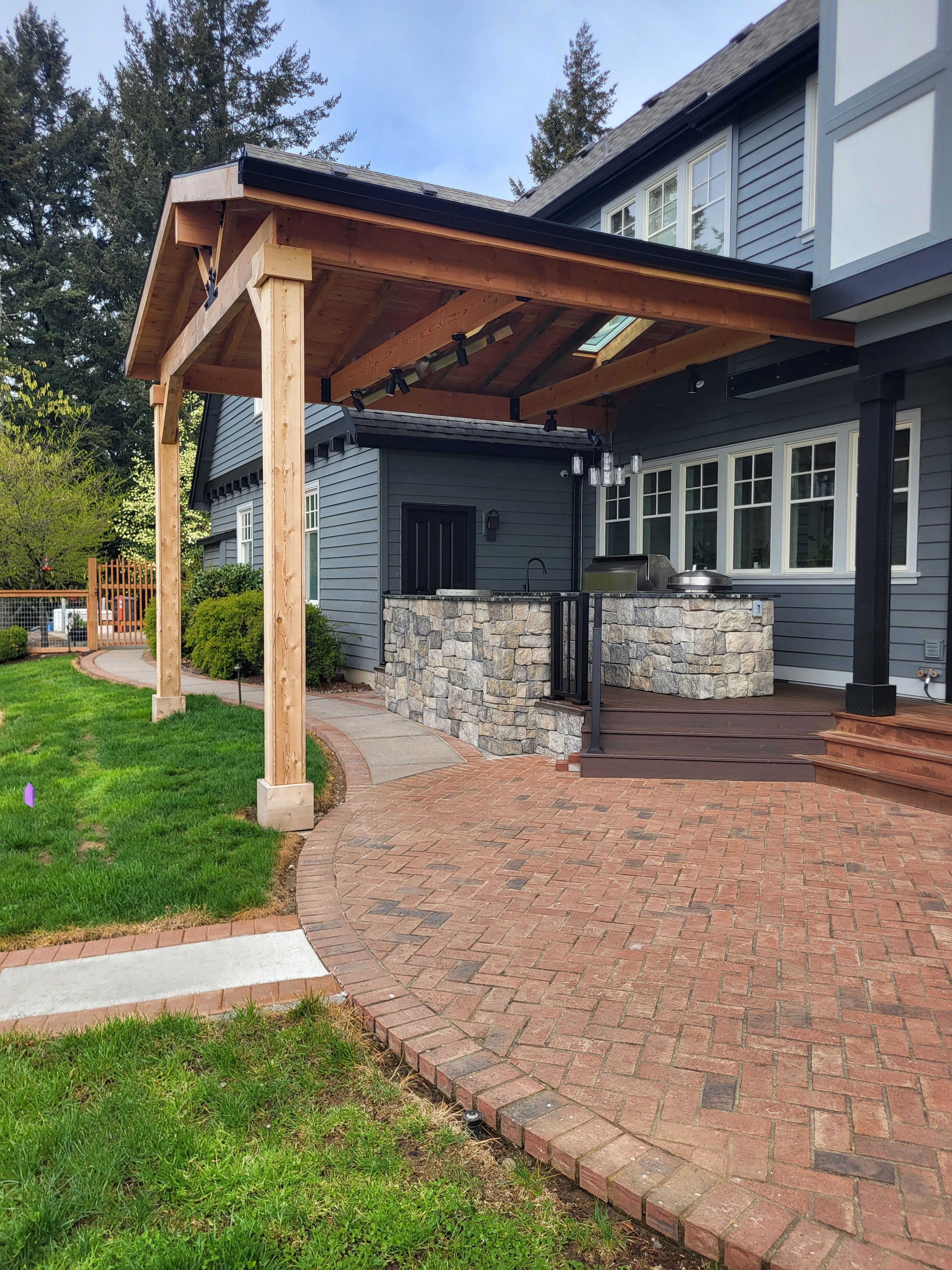 Custom Outdoor Kitchen and Timber-Framed Pavilion in Sherwood by American Made Construction 