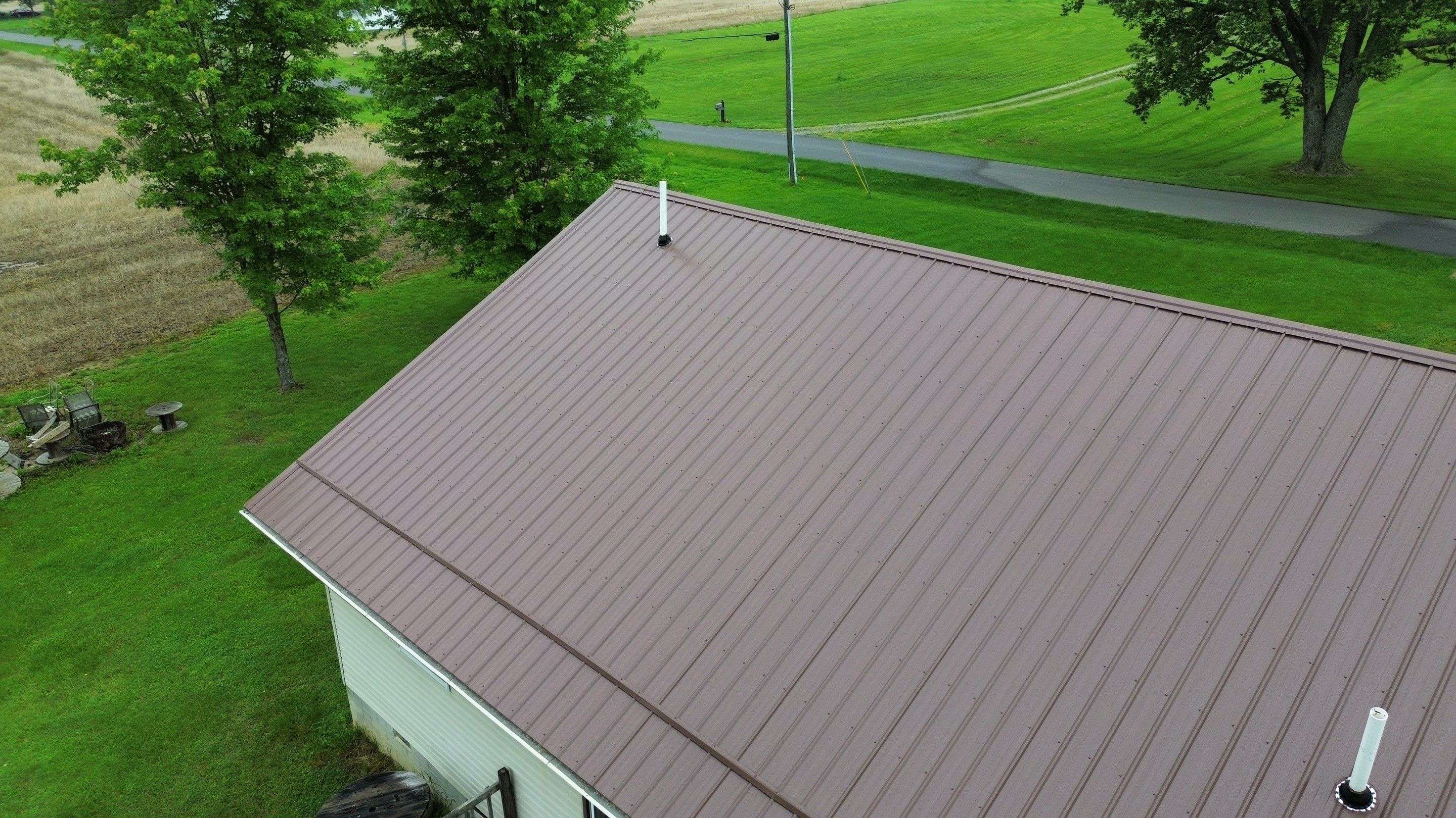 Residential Roofing Installation using Performance Panel Metal - Coca Brown by RoofX 