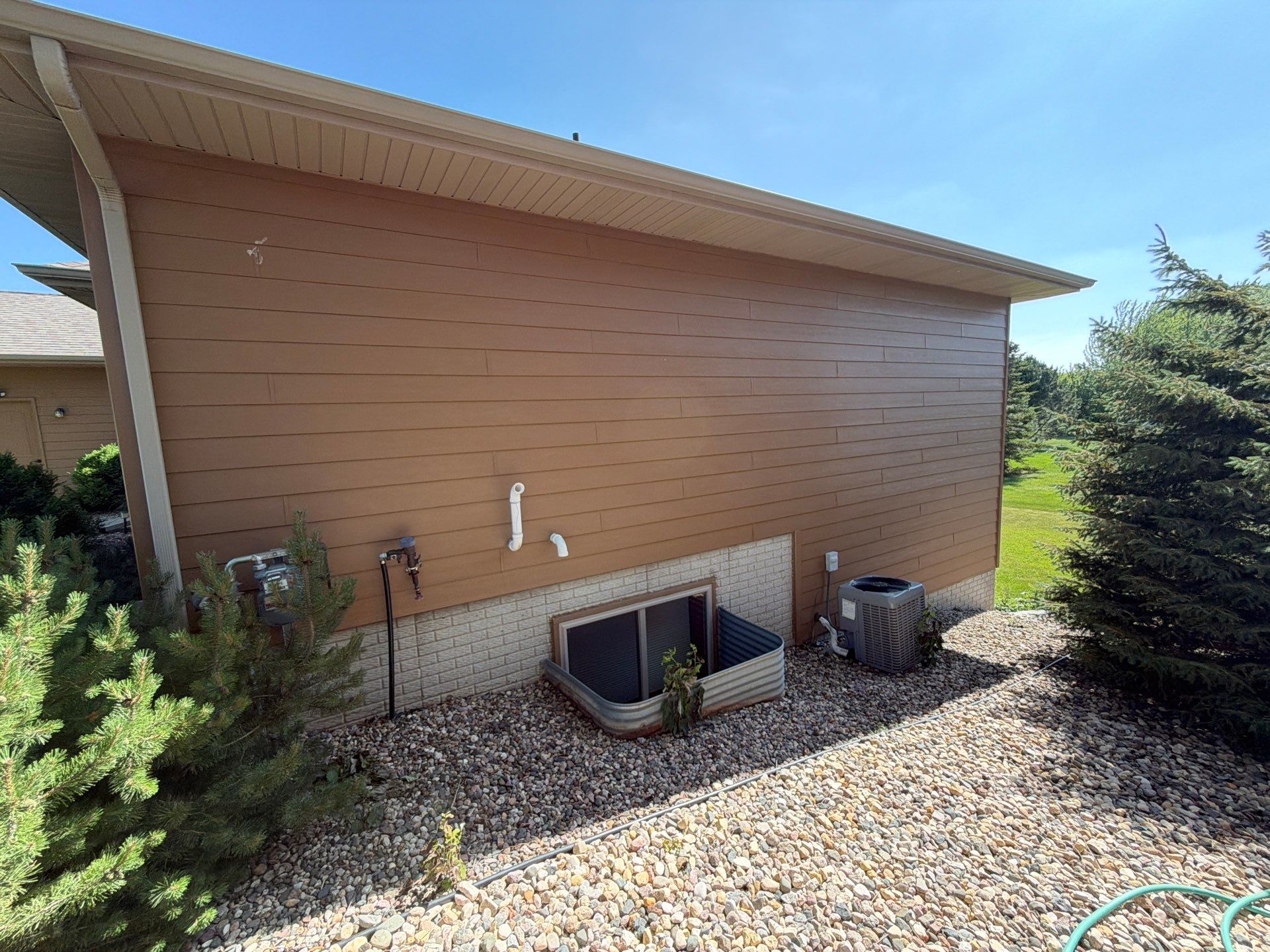 Full Exterior Residential Painting and Siding Refresh in Tea by Select Painting, Coatings & Garage Cabinets